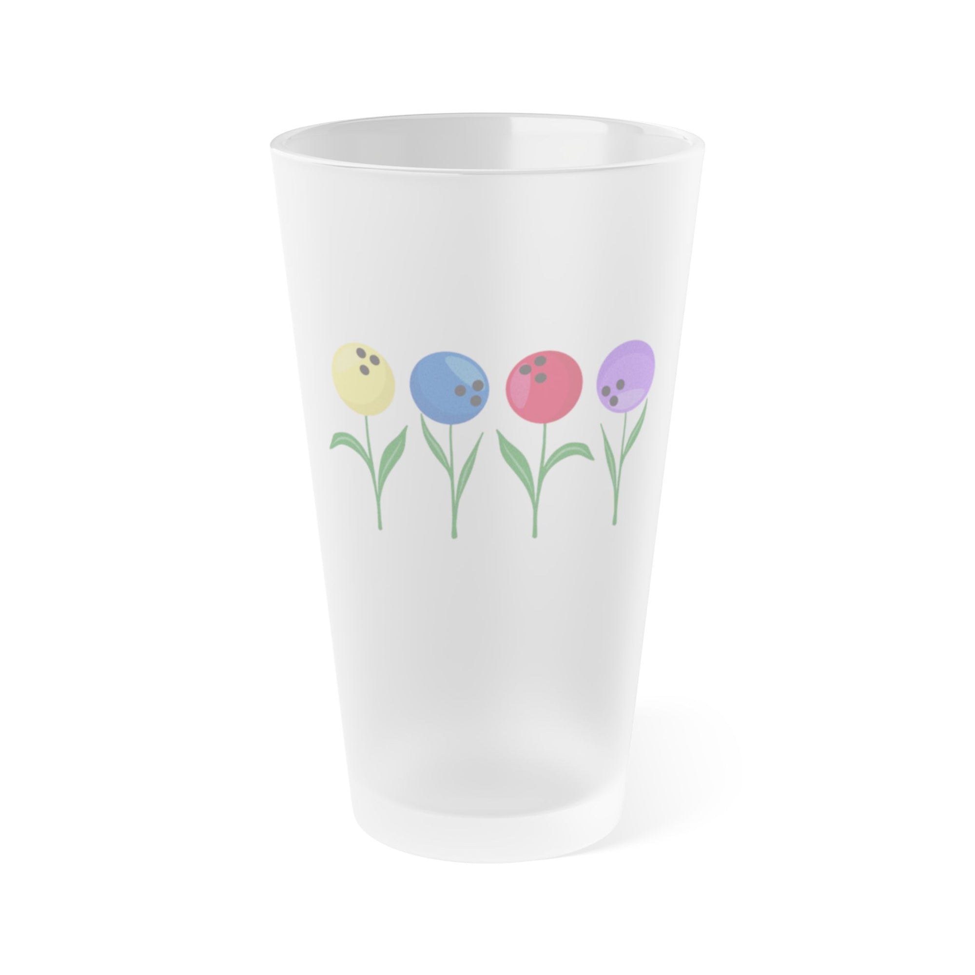 A frosted pint glass with colorful flowers made out of bowling balls, on a white background