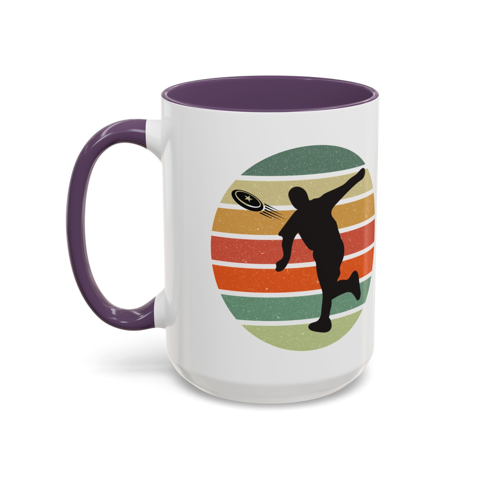 White ceramic coffee mug with purple accents on the handle and inside. The mug features a graphic of a silhouette of a disc golf player above a colorful retro design.