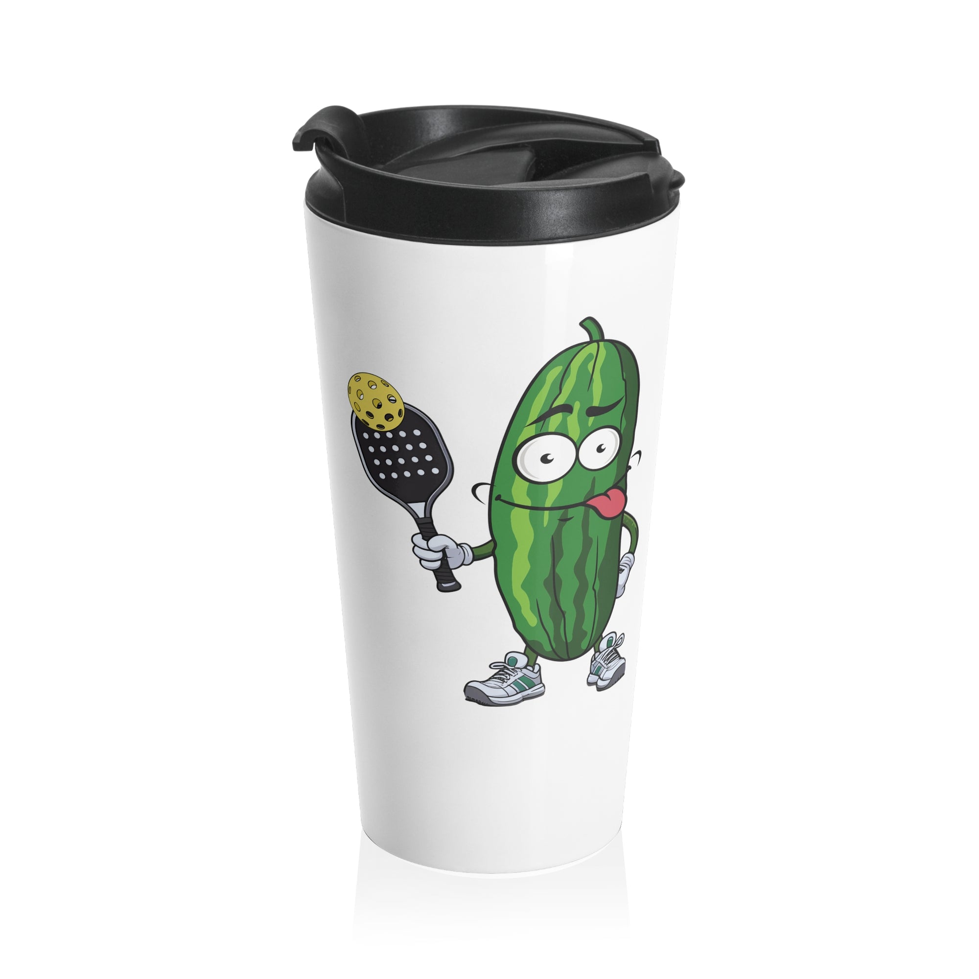 A white travel coffee mug with lid featuring a cartoon pickle with googly eyes and his tongue sticking out, holding a pickleball paddle with a yellow pickleball, against a white background