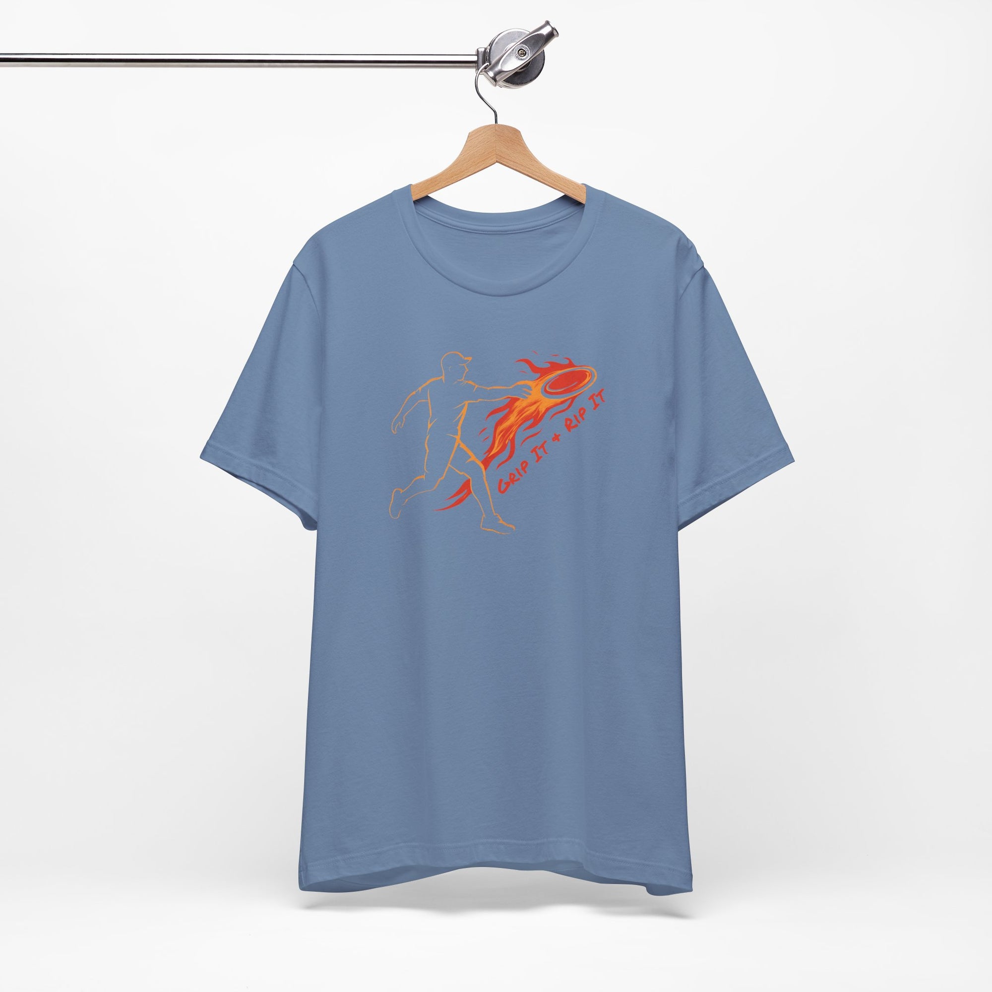 Aqua blue t-shirt with a graphic design of a person throwing a disc golf disc with flames coming off the disc and text 'Grip It or Rip It' on a hanger against a white background.