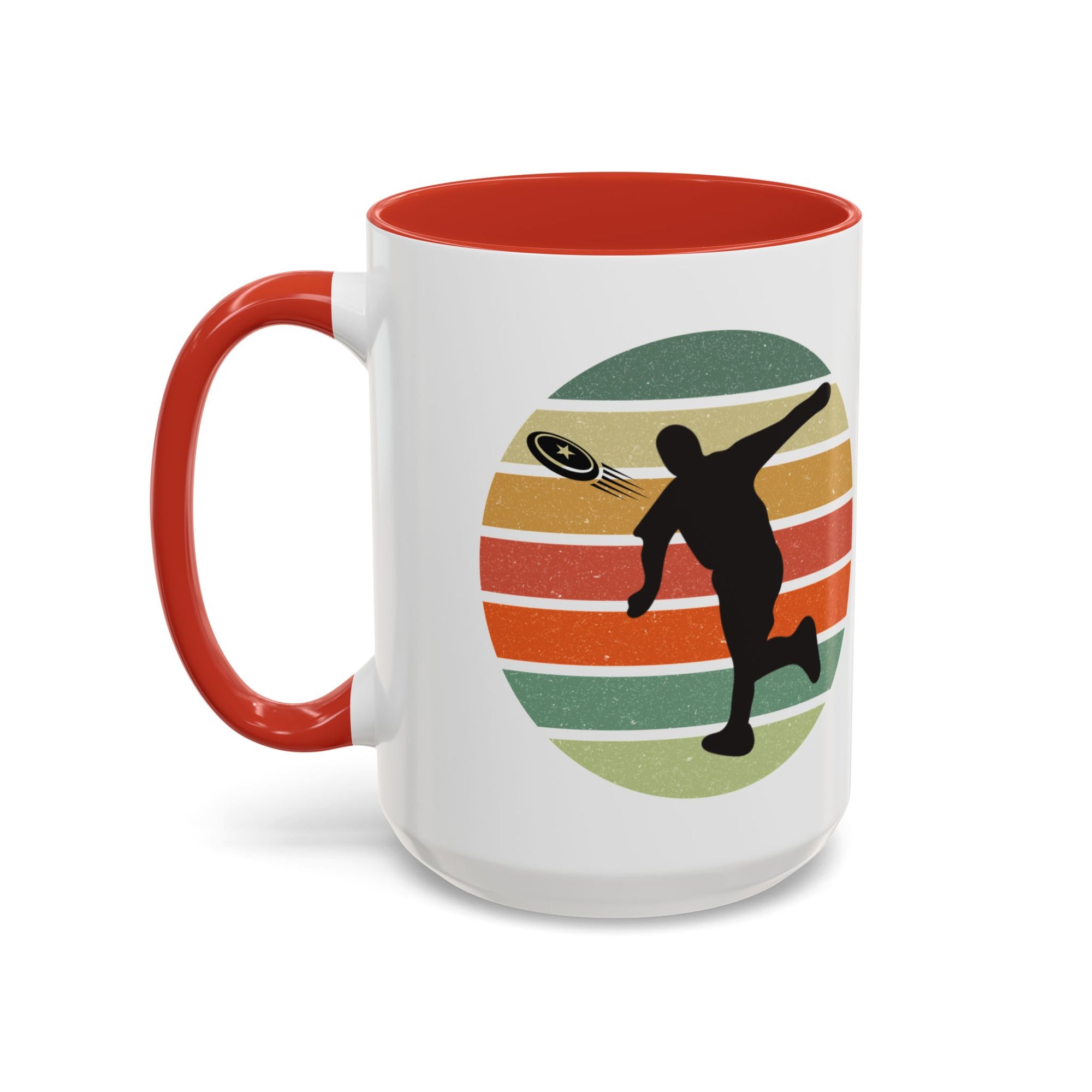 White ceramic coffee mug with red accents on the handle and inside. The mug features a graphic of a silhouette of a disc golf player above a colorful retro design.