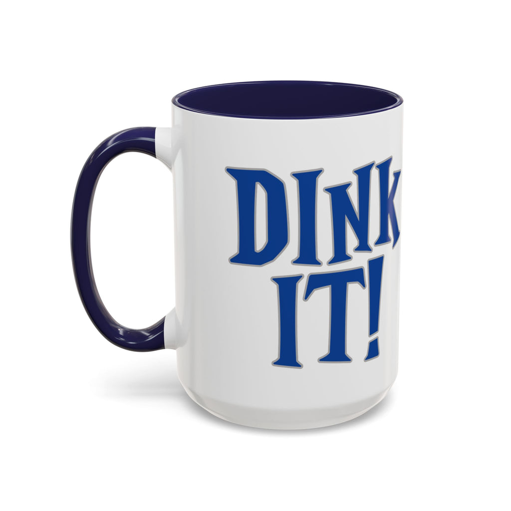 A ceramic coffee mug with dark blue accents on the handle and interior, with 'DINK IT!' text in blue and outlined in gray, against a white background