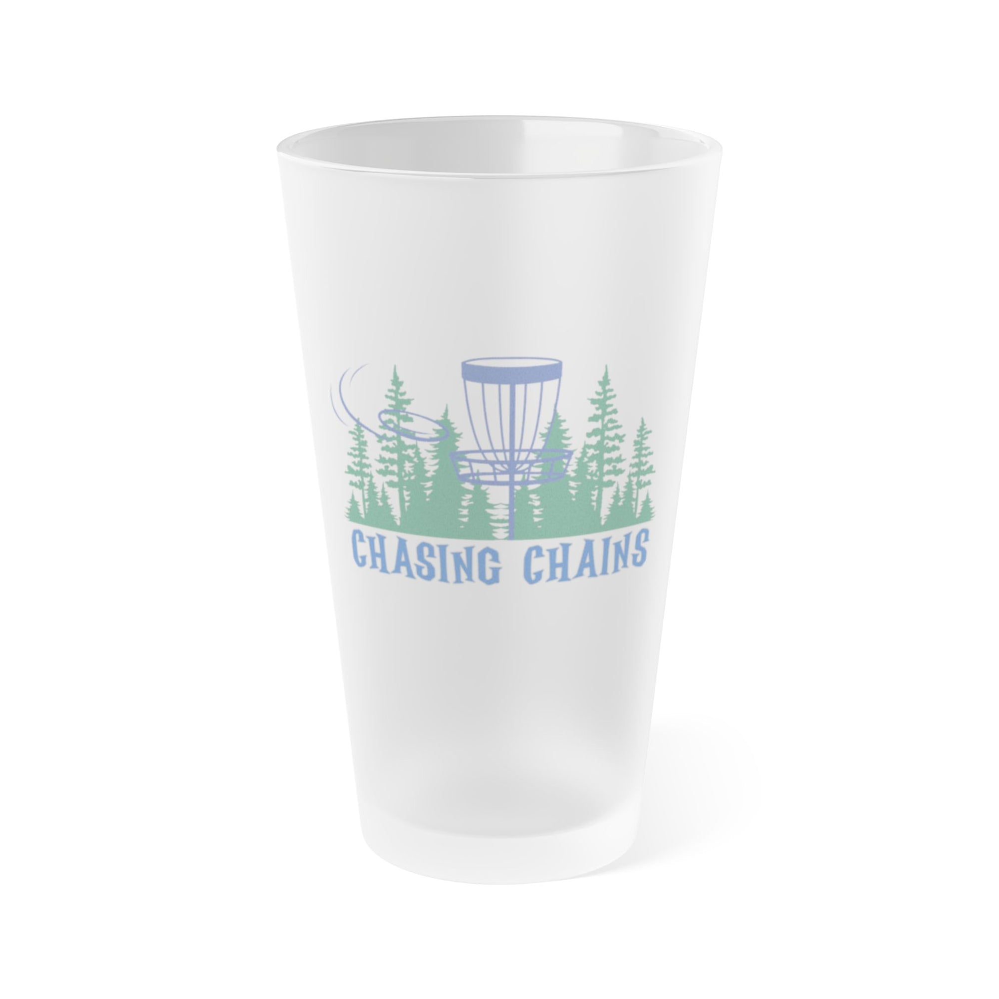 A frosted pint glass with a flying disc golf disc, basket, and chains in front of trees, with "Chasing Chains" below the design, on a white background
