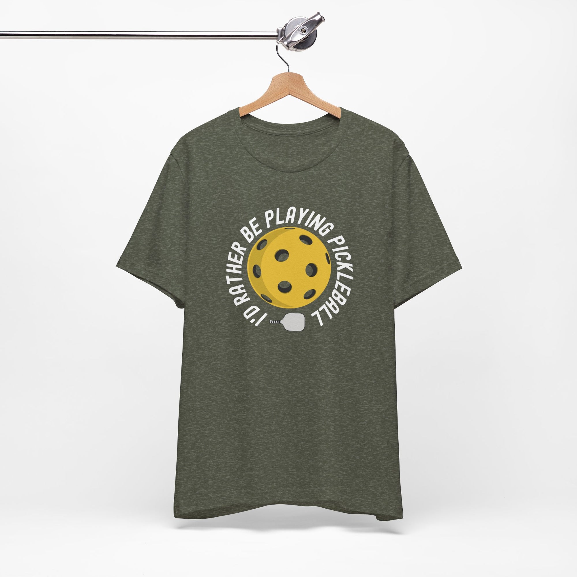 Gray t-shirt with a yellow pickleball and white pickleball paddle and the text "I'd Rather Be Playing Pickleball" on a hanger against a white background