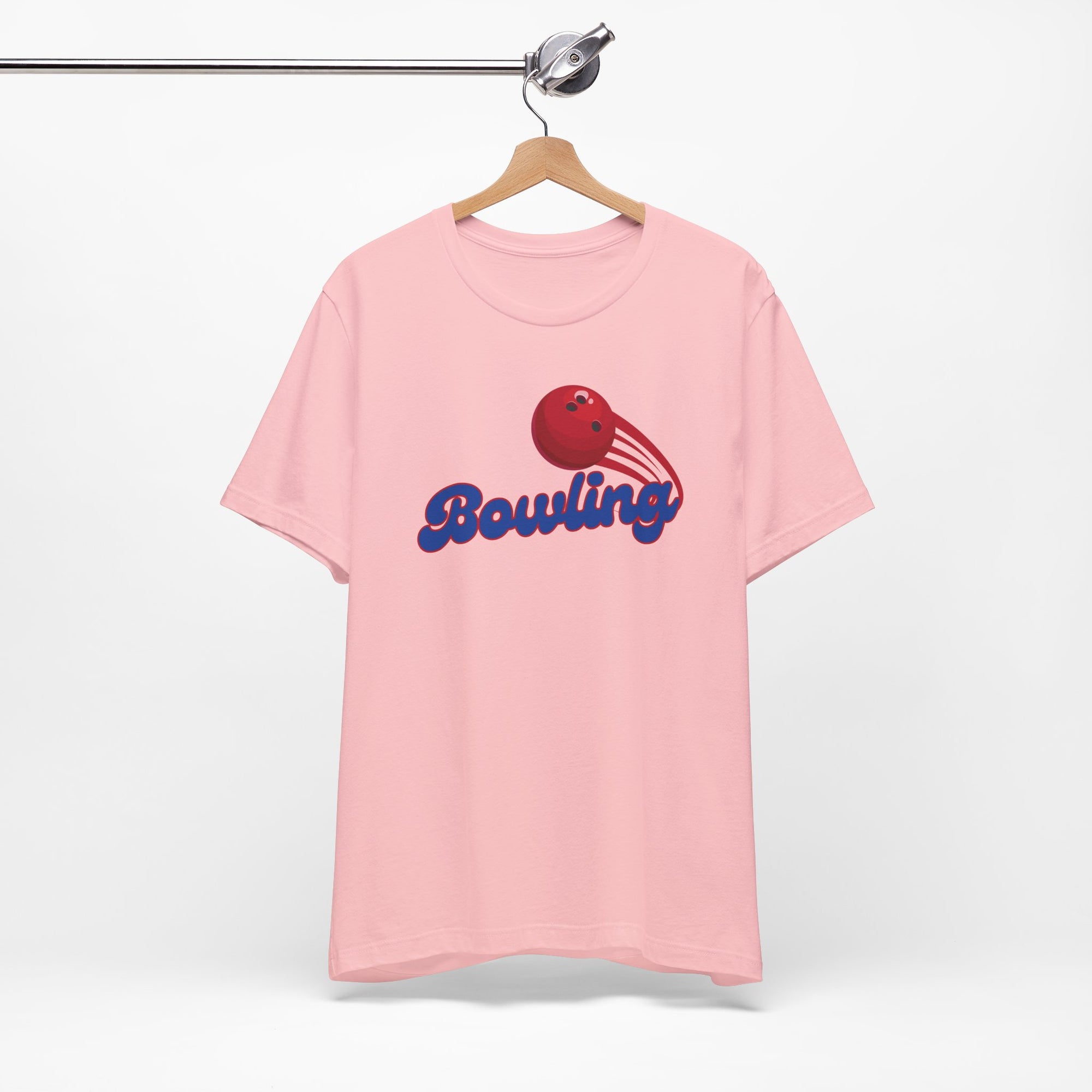 Pink t-shirt with a red bowling ball graphic and 'Bowling' text on a hanger against a white background