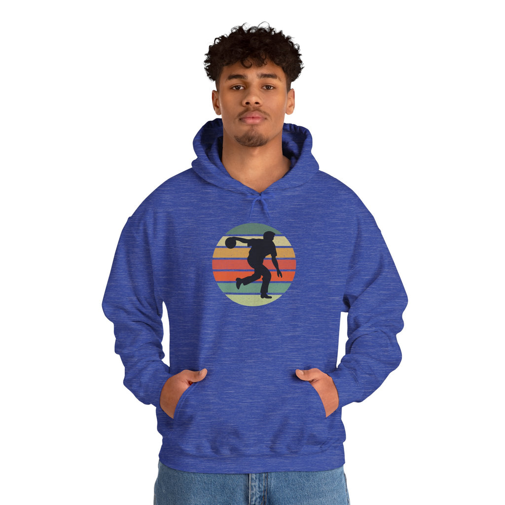 Man wearing a blue hoodie with a a graphic of a silhouette of a bowler over a colorful retro image, on a white background