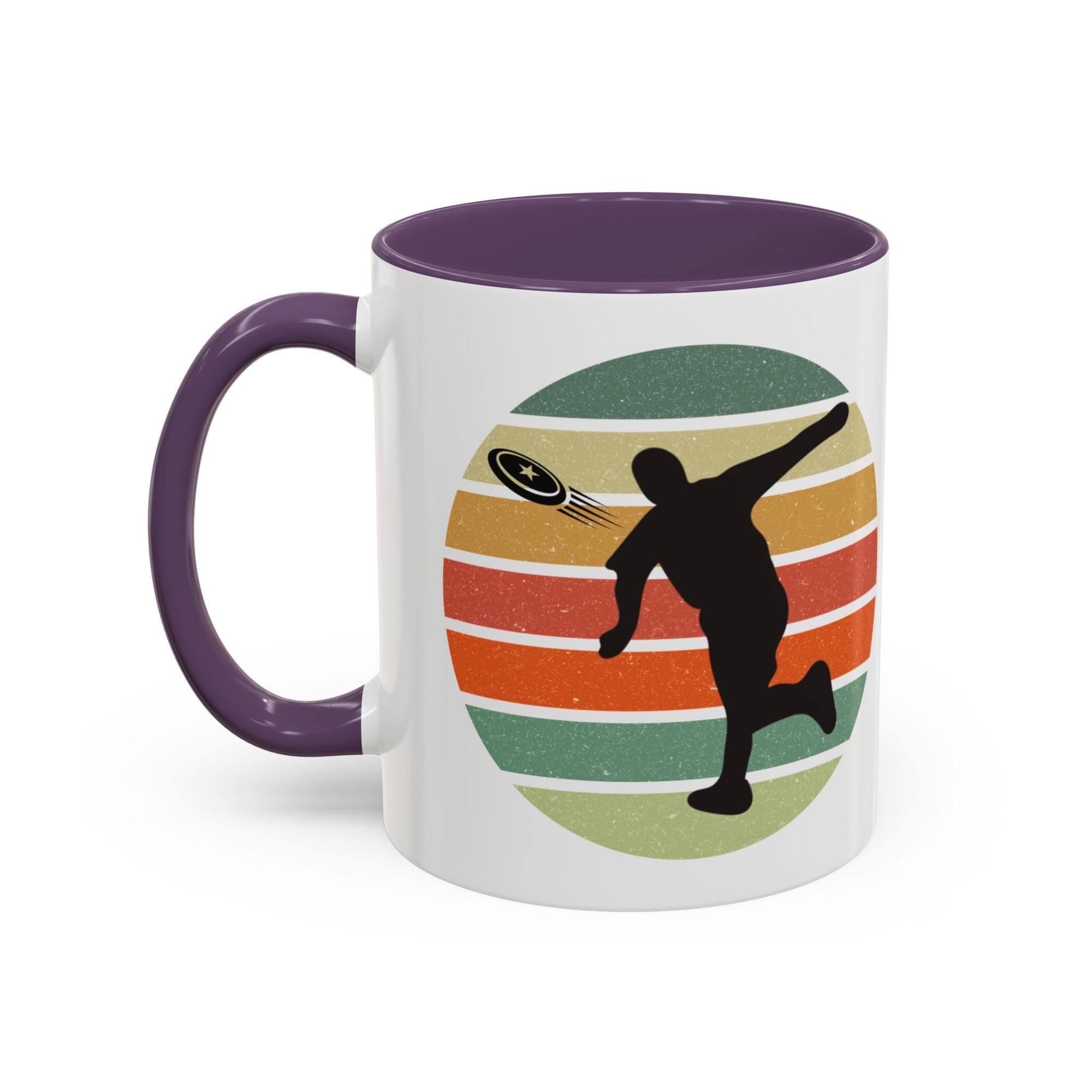 White ceramic coffee mug with purple accents on the handle and inside. The mug features a graphic of a silhouette of a disc golf player above a colorful retro design.