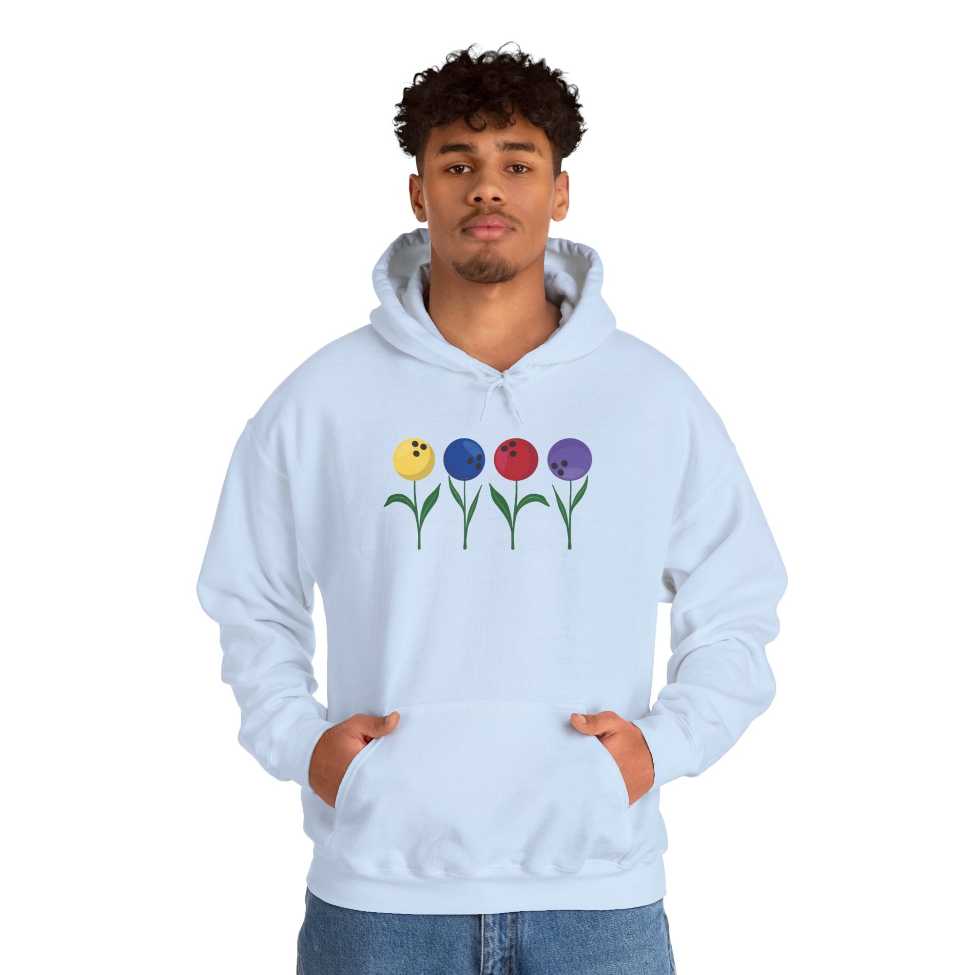 A man wearing a light blue hoodie with colorful flowers made out of bowling balls, on a white background