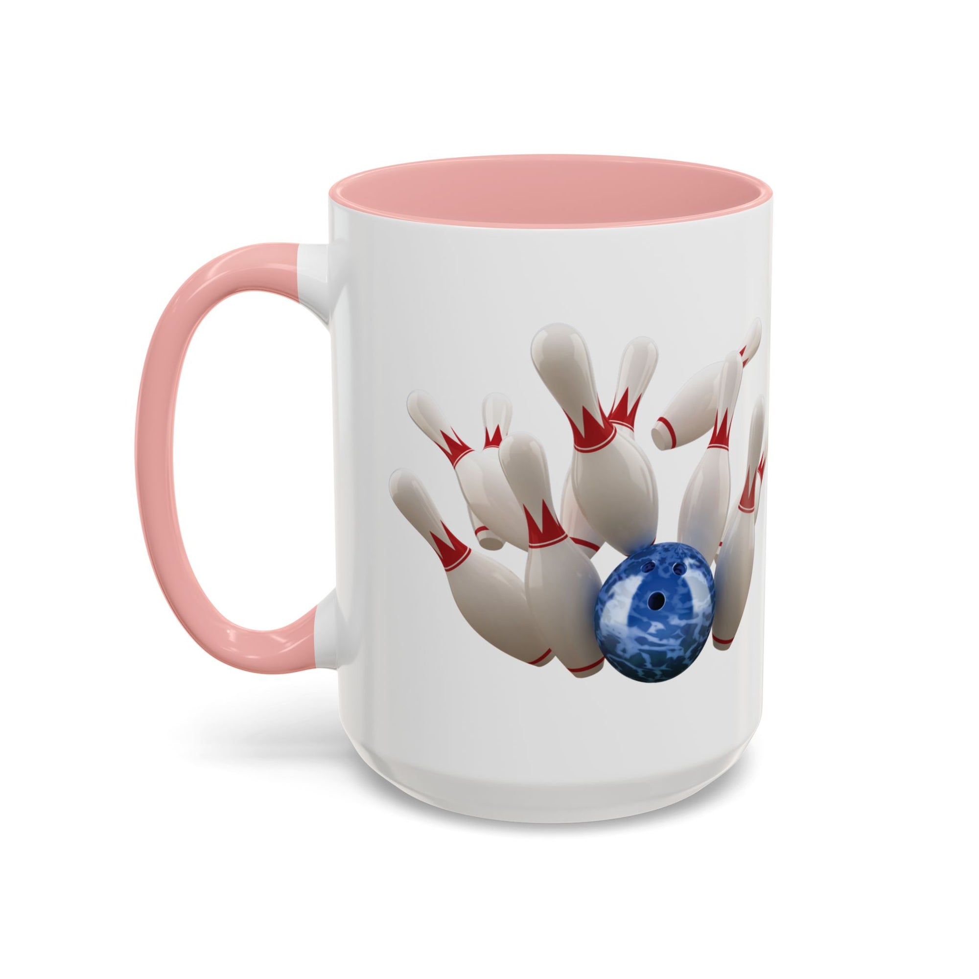 A white ceramic coffee mug with pink accents on the handle and interior, with a graphic of a blue bowling ball knocking over bowling pins, on a white background