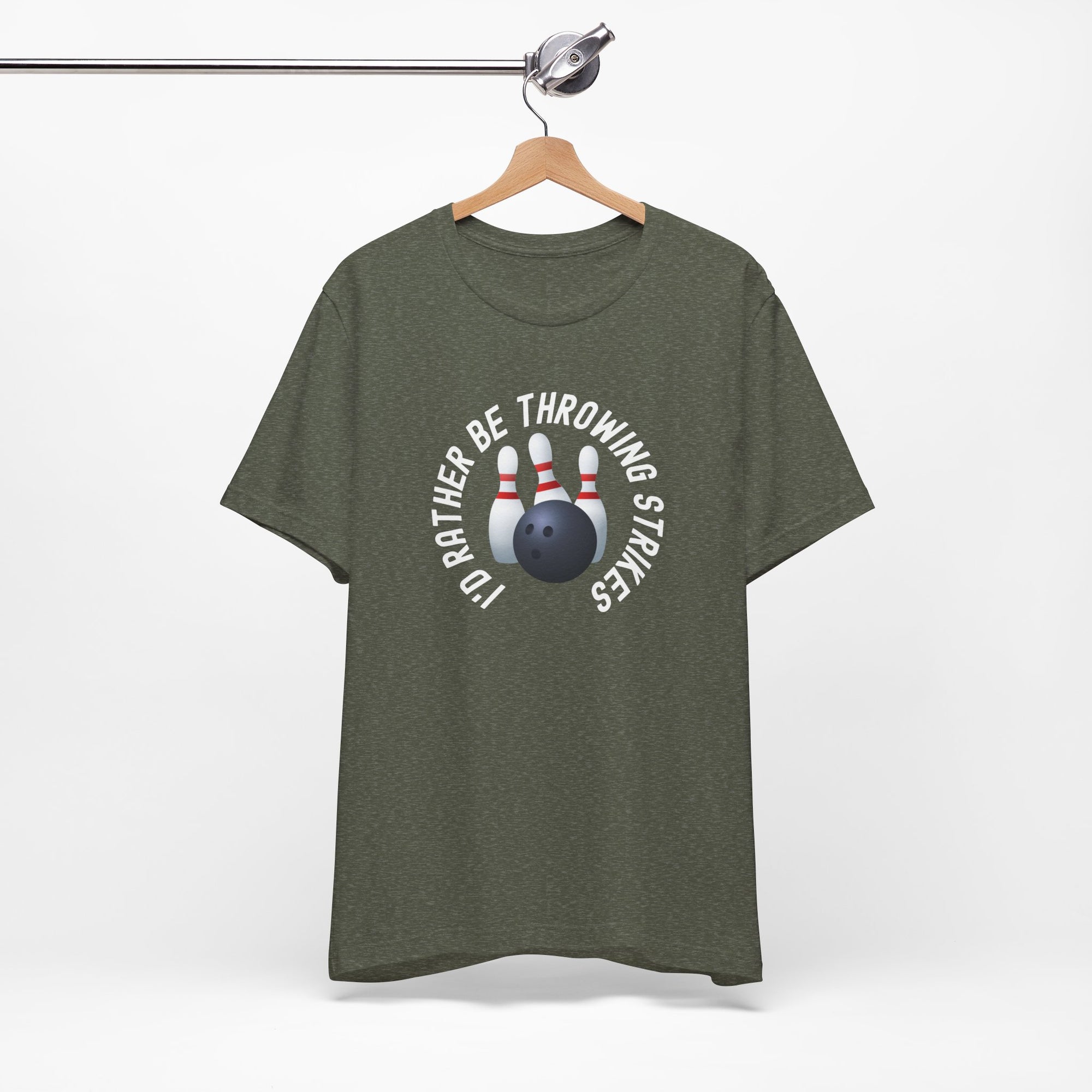 Military green t-shirt with bowling pins and a bowling ball and text saying "I'd Rather Be Throwing Strikes" on a hanger against a white background