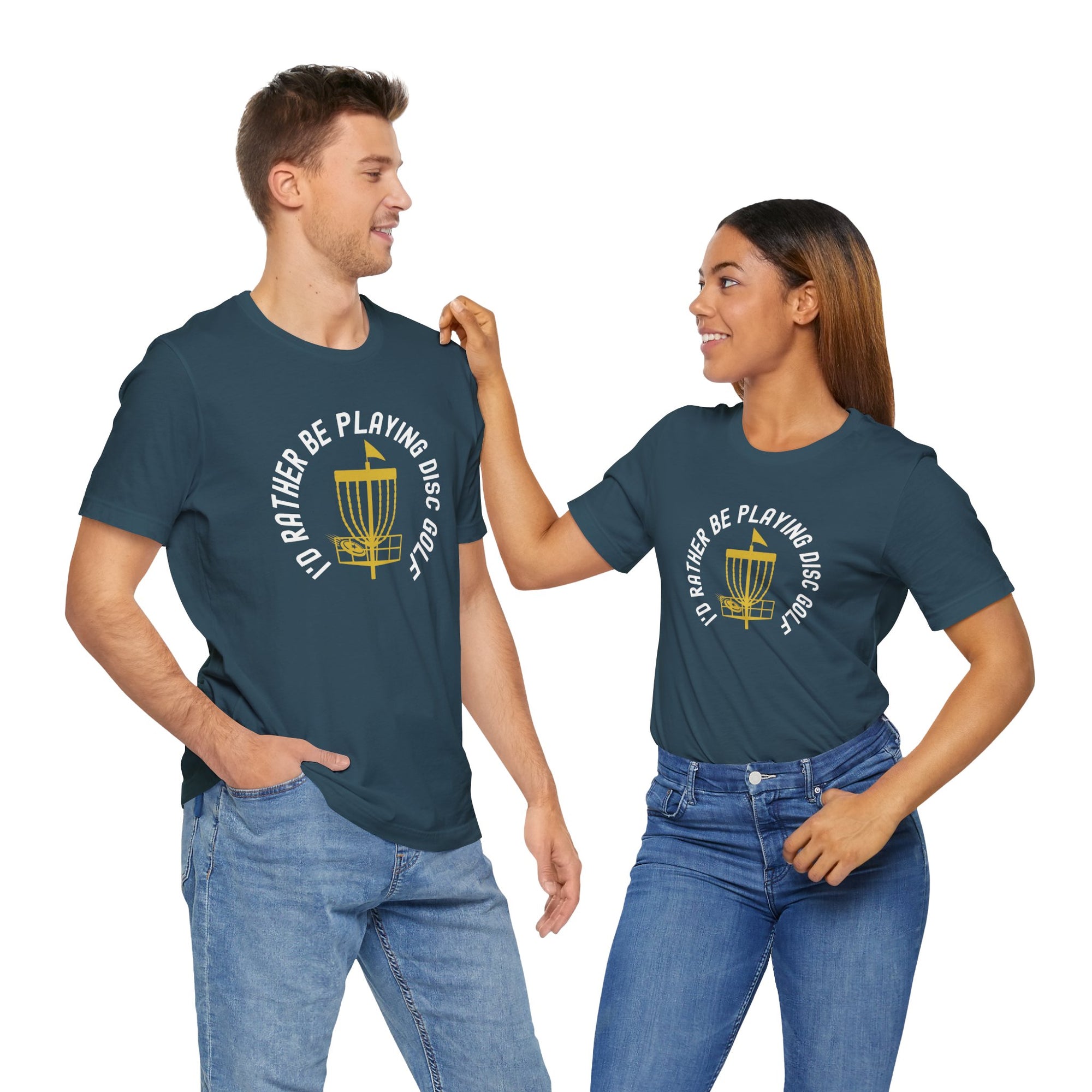 A man and a woman wearing teal t-shirts with a graphic of disc golf chains, basket, and disc and text that says "I'd Rather Be Playing Disc Golf" on a hanger against a white background