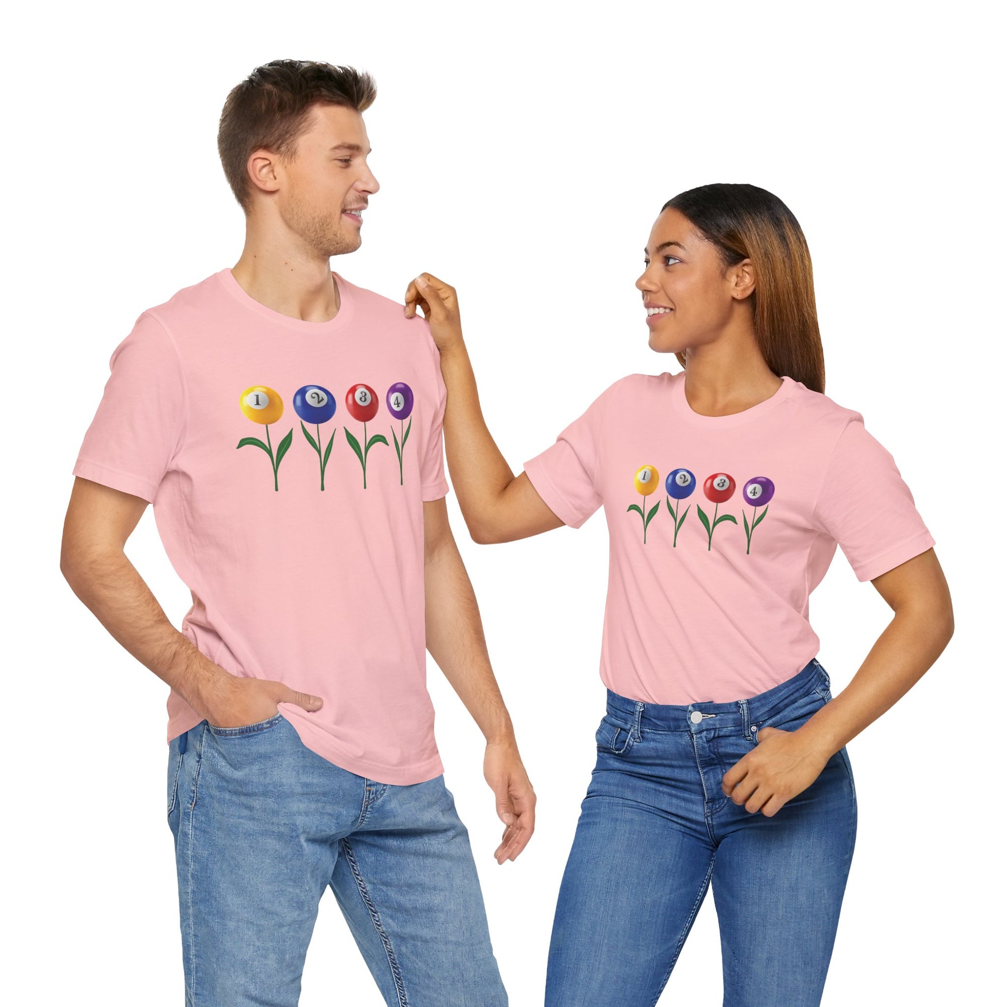 A man and a woman both wearing a pink t-shirt with four colorful flowers made out of billiards balls with green stems, against a white background
