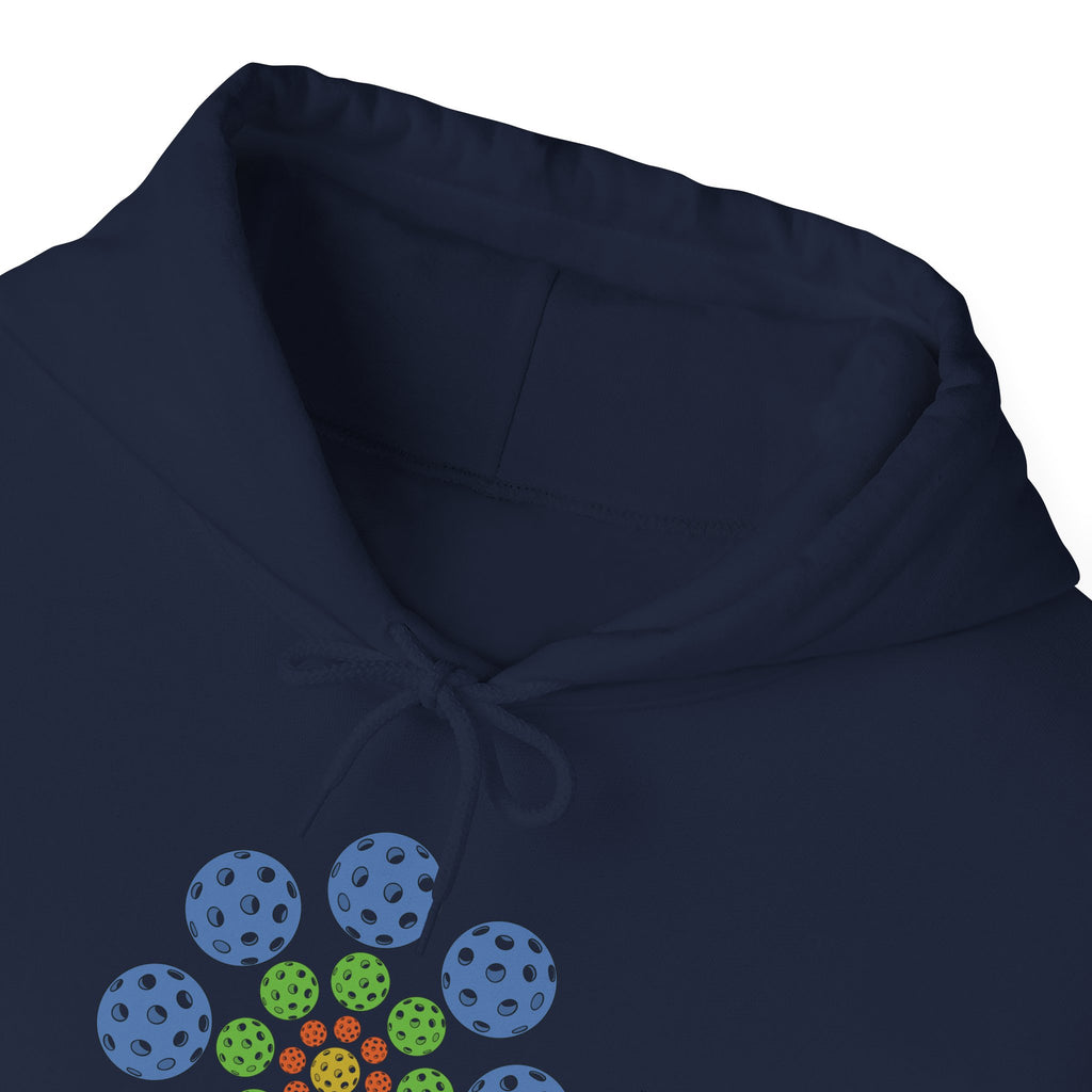 Neckline view of a navy blue hoodie with colorful geometric design of pickleballs against a white background