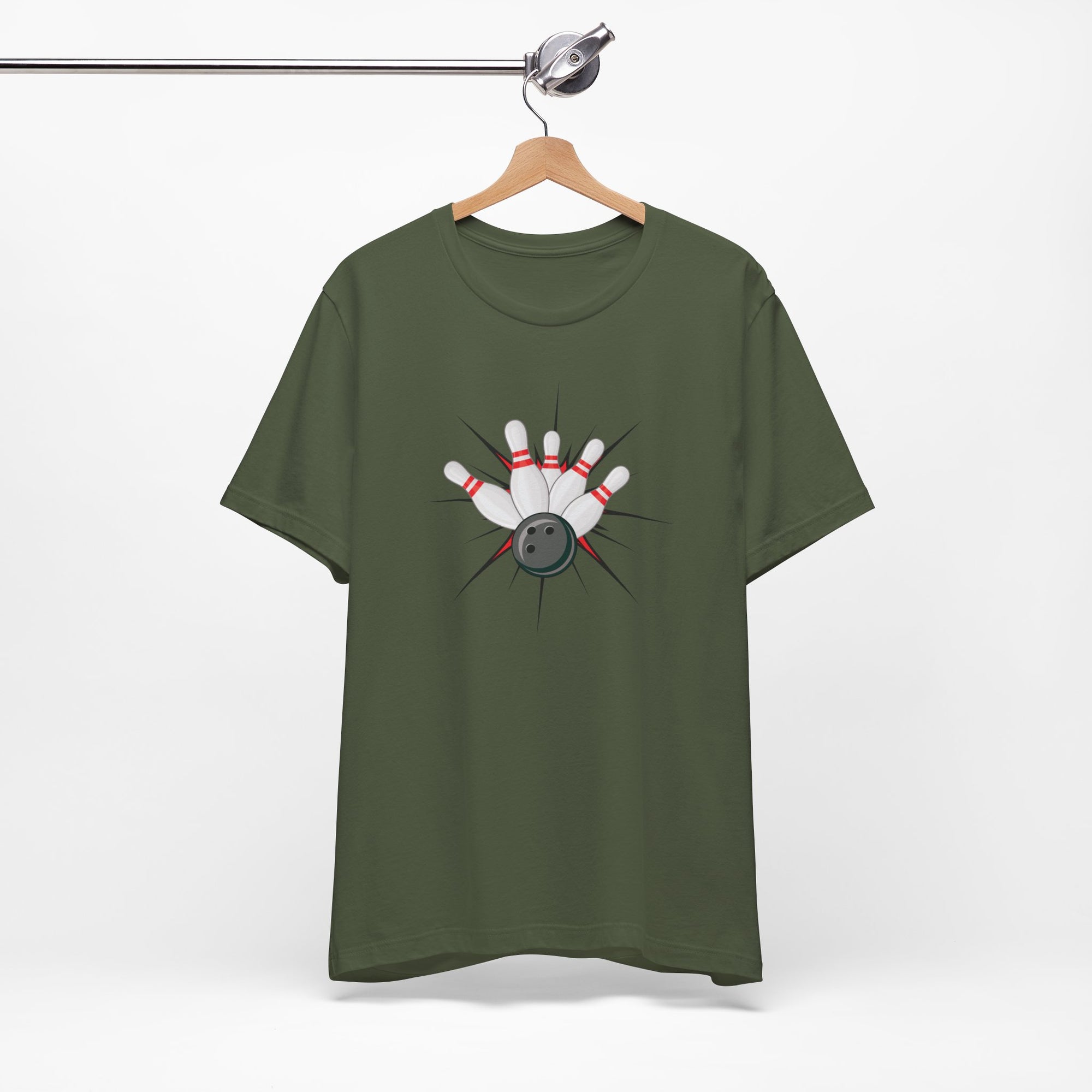 Military green t-shirt with a graphic design of a bowling ball smashing into pins on a hanger against a white background