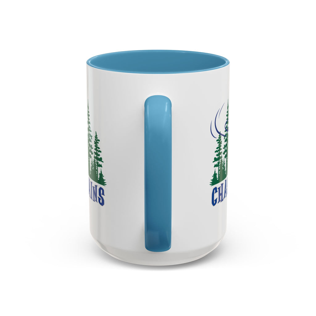 Back view of the handle of a ceramic coffee mug with blue accents on the handle and interior, with 'Chasing Chains' graphic featuring a flying disc golf disc and basket and chains in front of a scenic evergreen tree landscape, against a white background