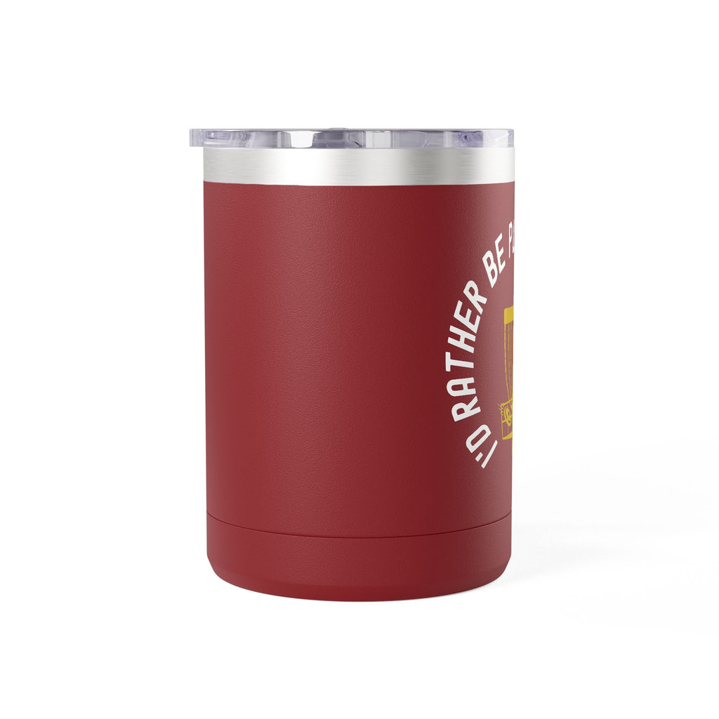 Side view of a maroon travel coffee tumbler with lid and handle, with a graphic of disc golf chains, basket, and disc and text that says "I'd Rather Be Playing Disc Golf" against a white background.