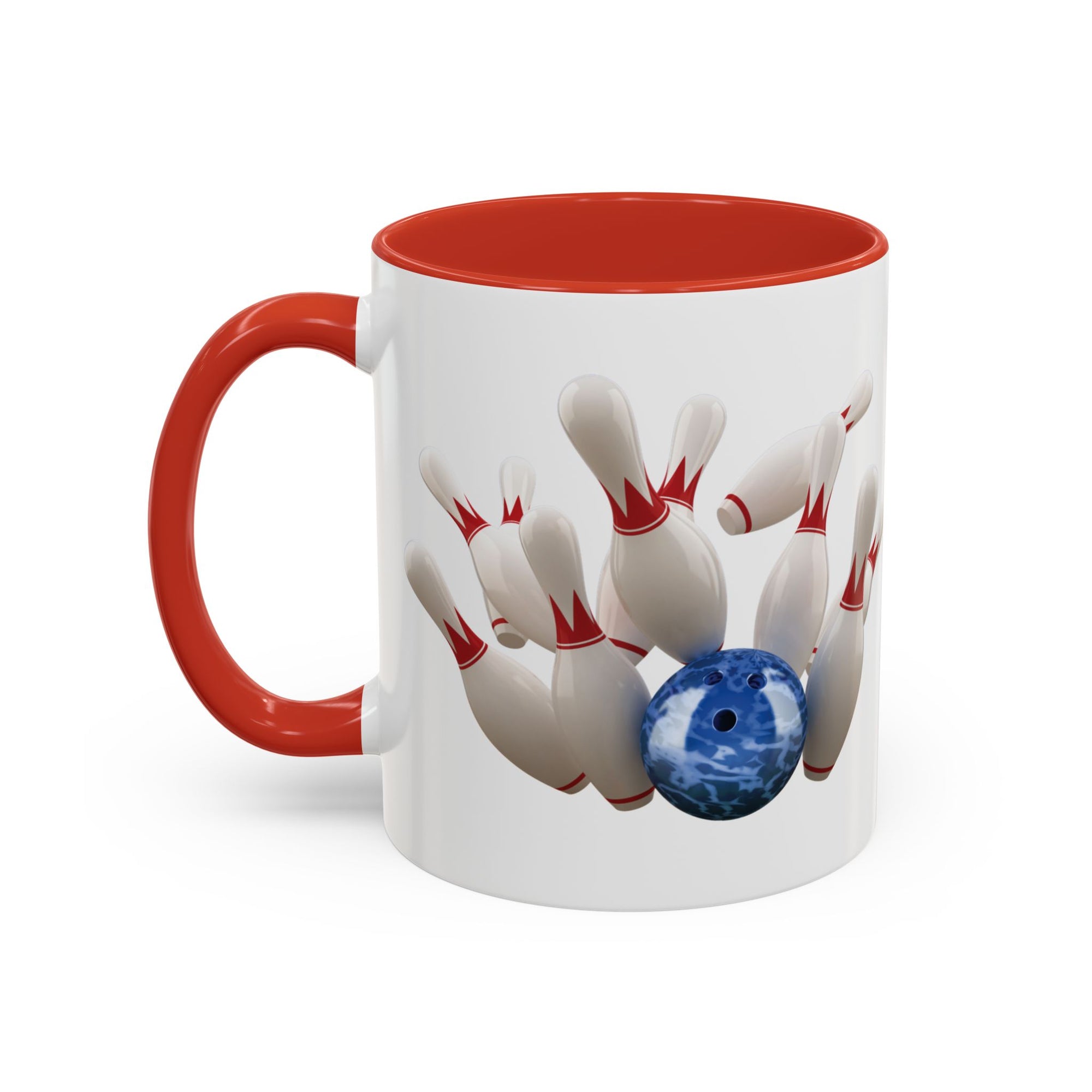 A white ceramic coffee mug with red accents on the handle and interior, with a graphic of a blue bowling ball knocking over bowling pins, on a white background