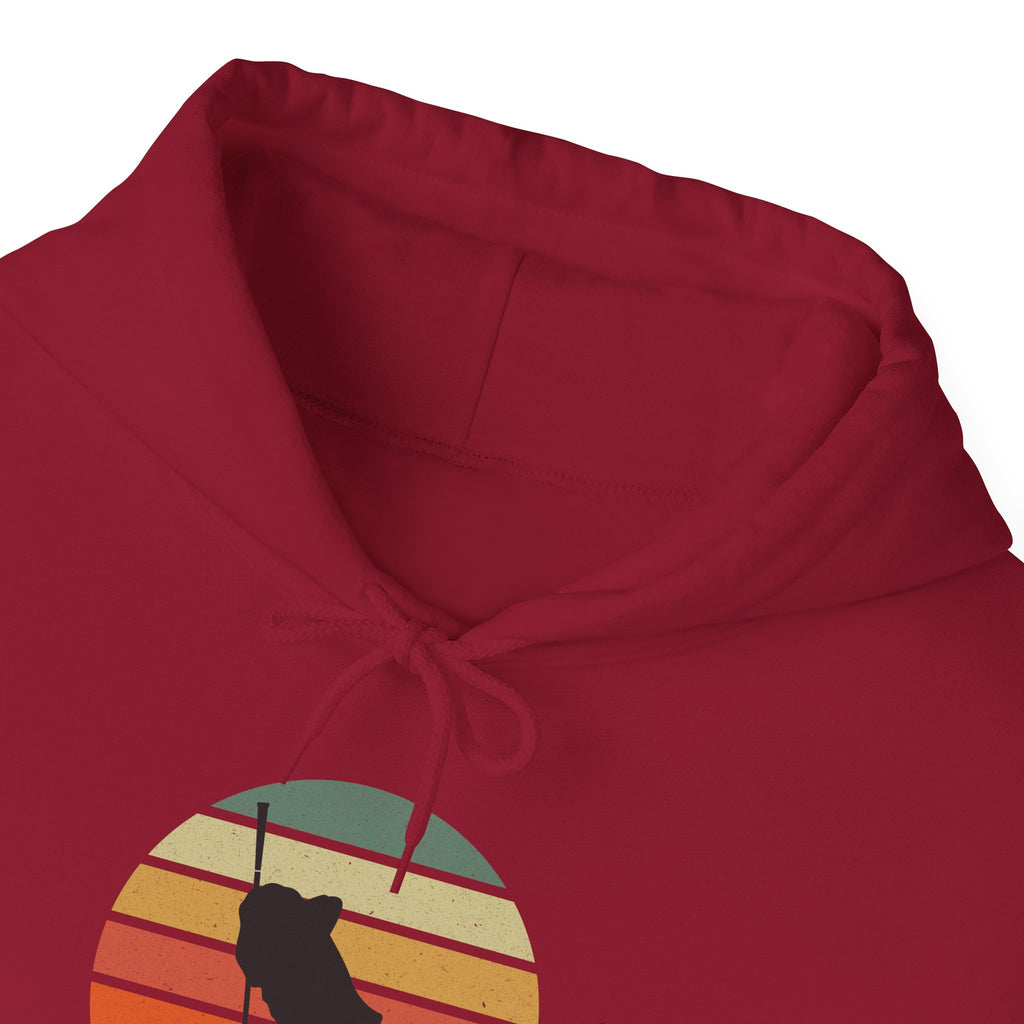 Neckline of a red hoodie with a graphic of a billiards player silhouette over a retro colorful image against a white background.