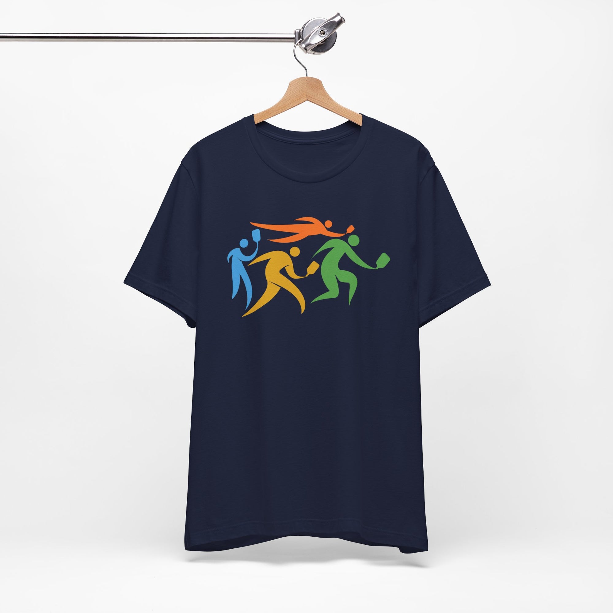 Dark blue t-shirt featuring an image of four colorful pickleball player drawings playing pickleball, on a hanger against a white background