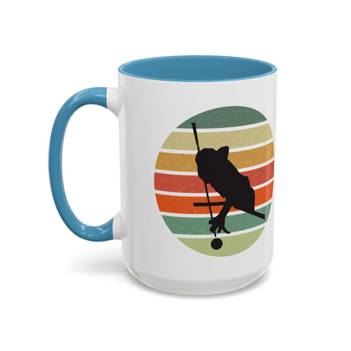 Mug with light blue accents and a graphic of a billiards player silhouette over a colorful retro design on a white background.