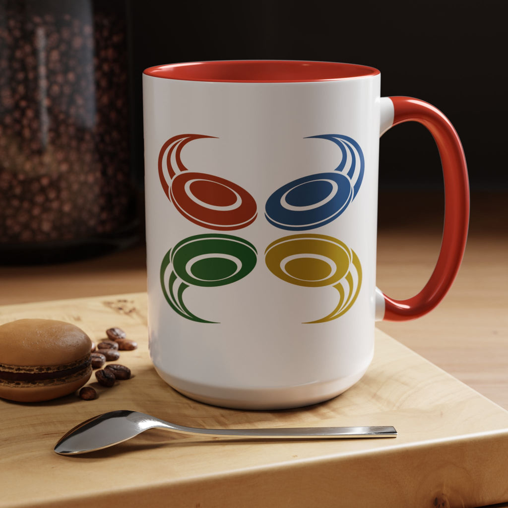 A ceramic mug with red accents on the handle and interior, featuring a graphic of four colorful disc golf discs in a coffee shop setting