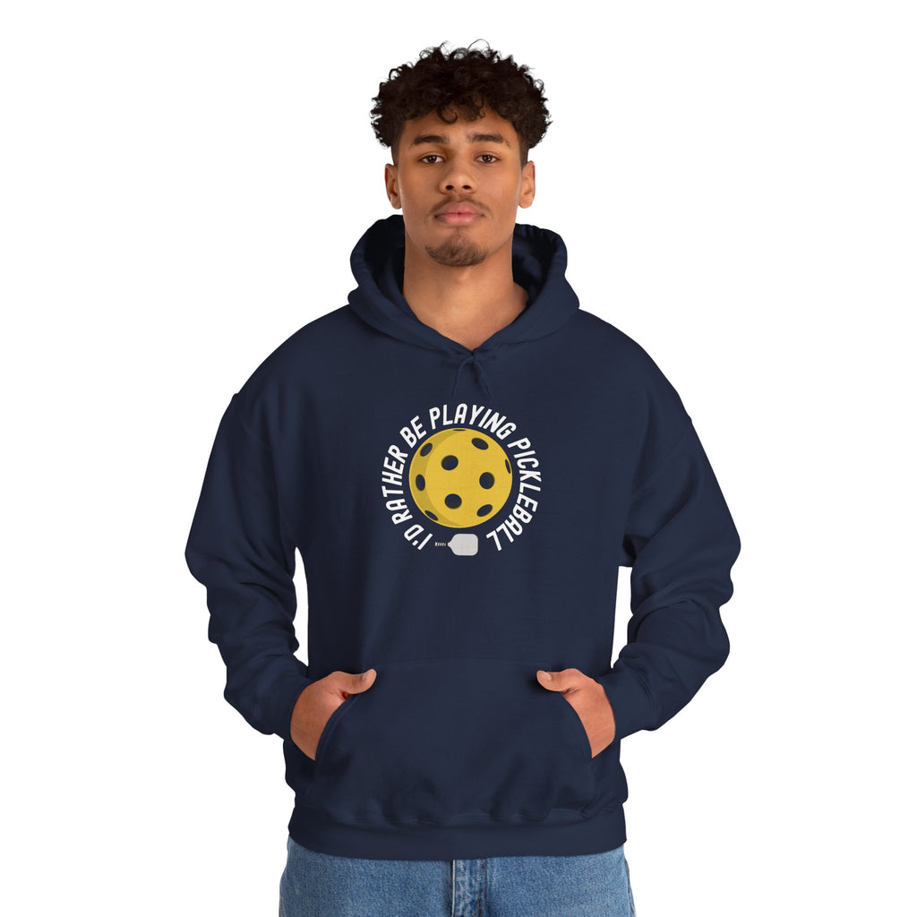 Man wearing a navy blue hoodie with graphic of a yellow pickleball and white paddle with the text "I'd Rather Be Playing Pickleball" on a white background