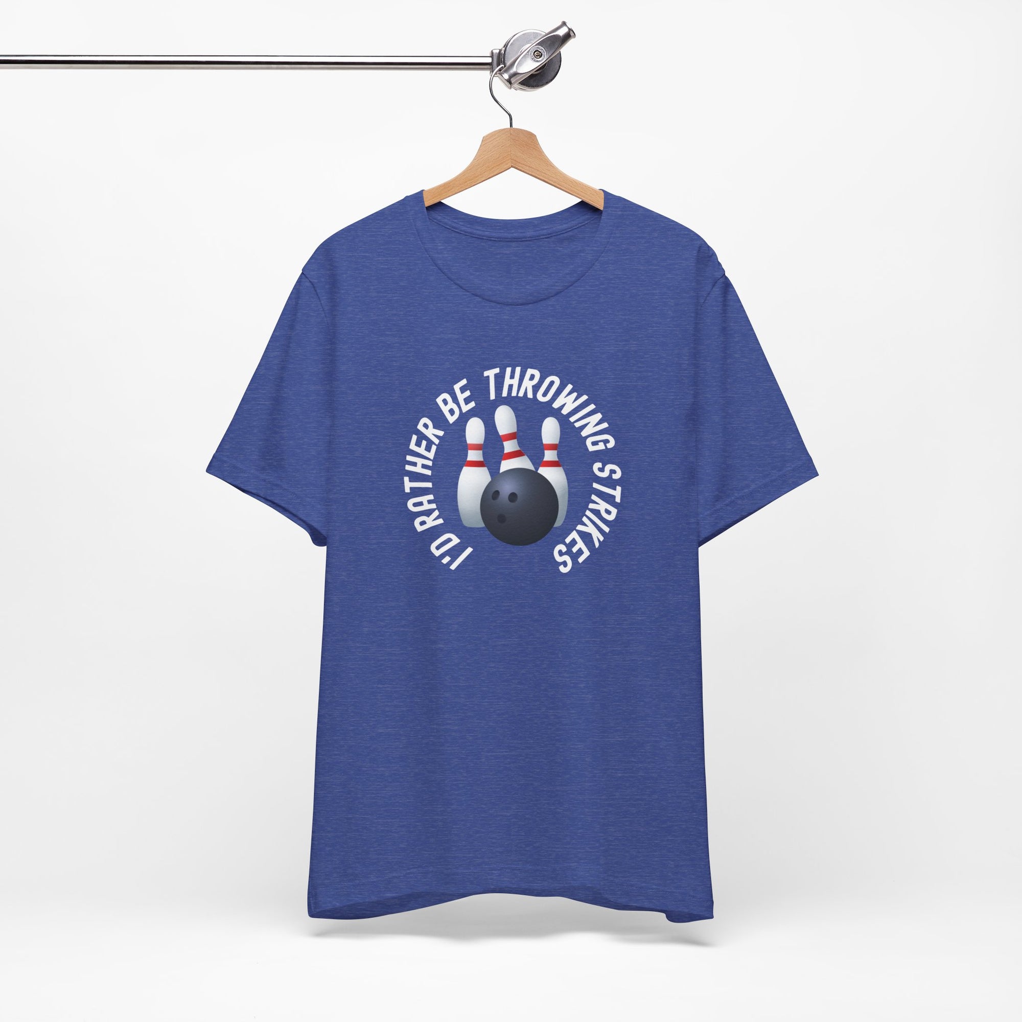 Blue t-shirt with bowling pins and a bowling ball and text saying "I'd Rather Be Throwing Strikes" on a hanger against a white background