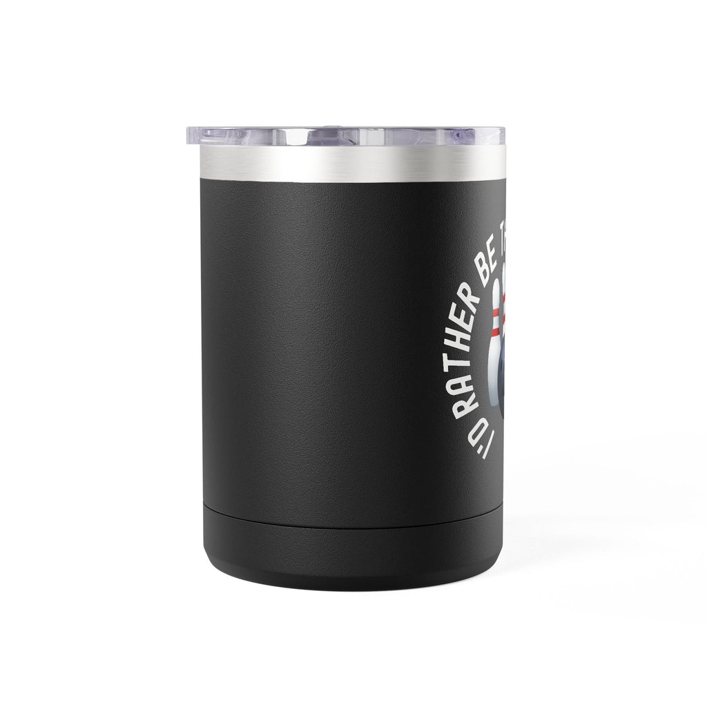 Side view of a black travel mug with a sip lid and handle, with bowling pins and a bowling ball and text saying "I'd Rather Be Throwing Strikes" on white background