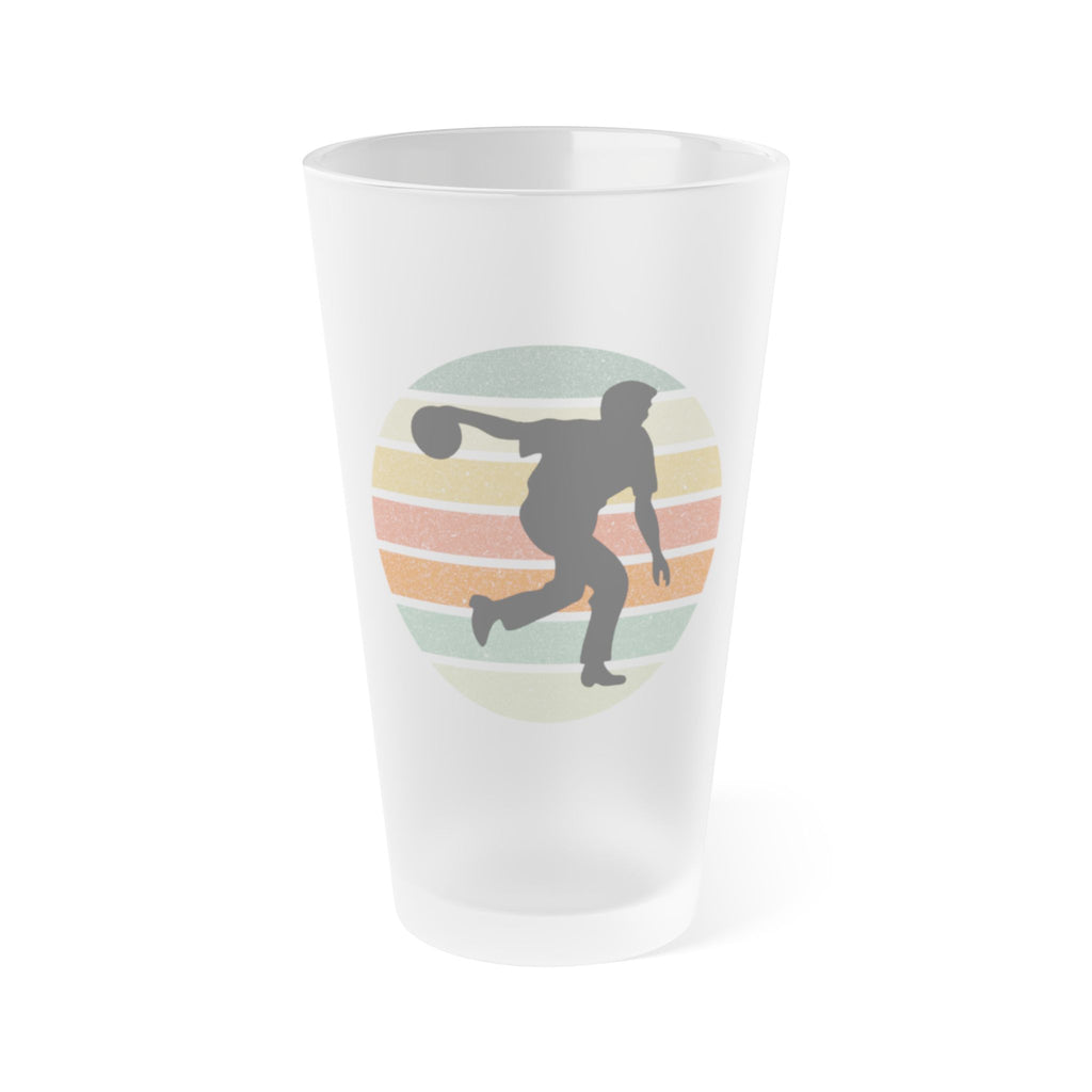 Frosted pint glass with a silhouette of a person bowling on a colorful background