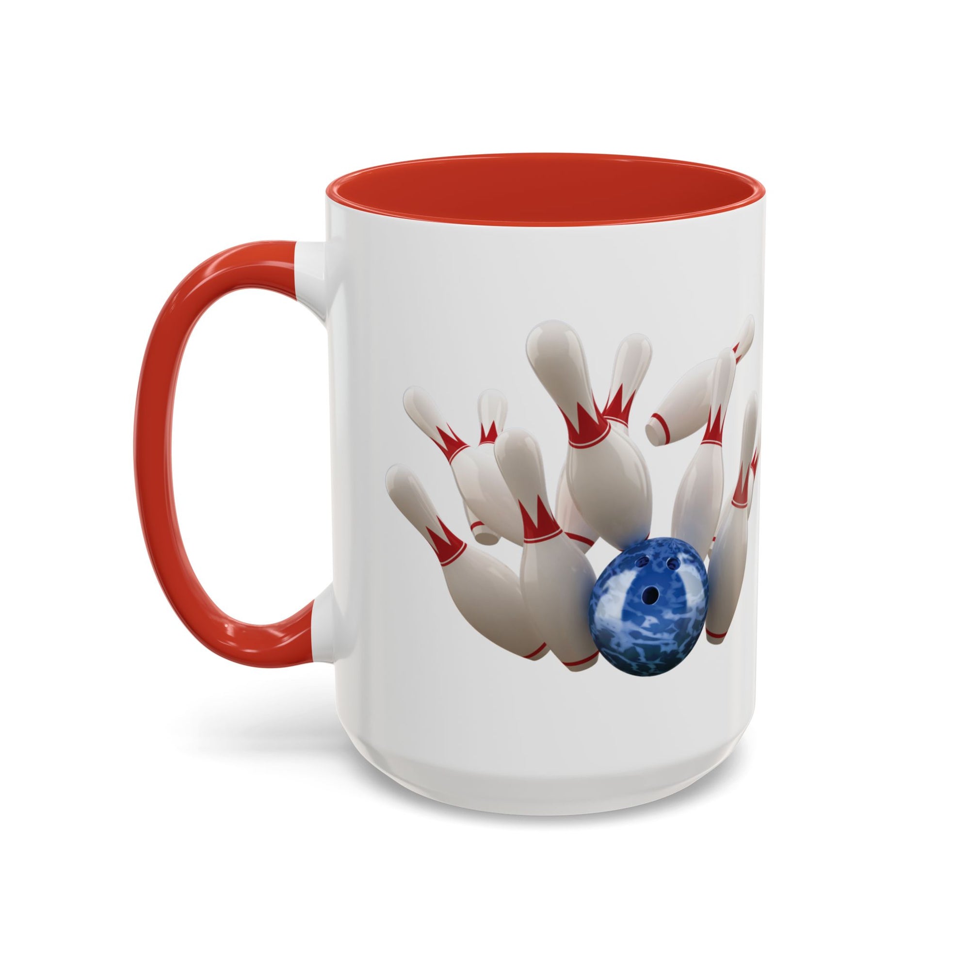 A white ceramic coffee mug with red accents on the handle and interior, with a graphic of a blue bowling ball knocking over bowling pins, on a white background