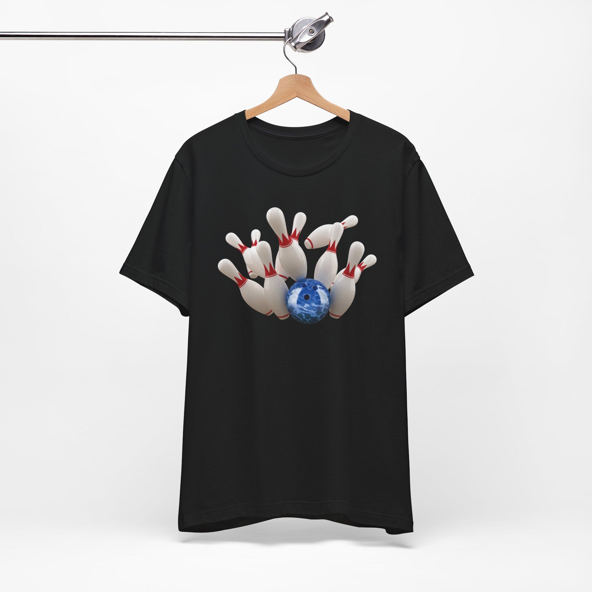 Black t-shirt with a graphic of a blue bowling ball knocking over bowling pins, on a hanger against a white background