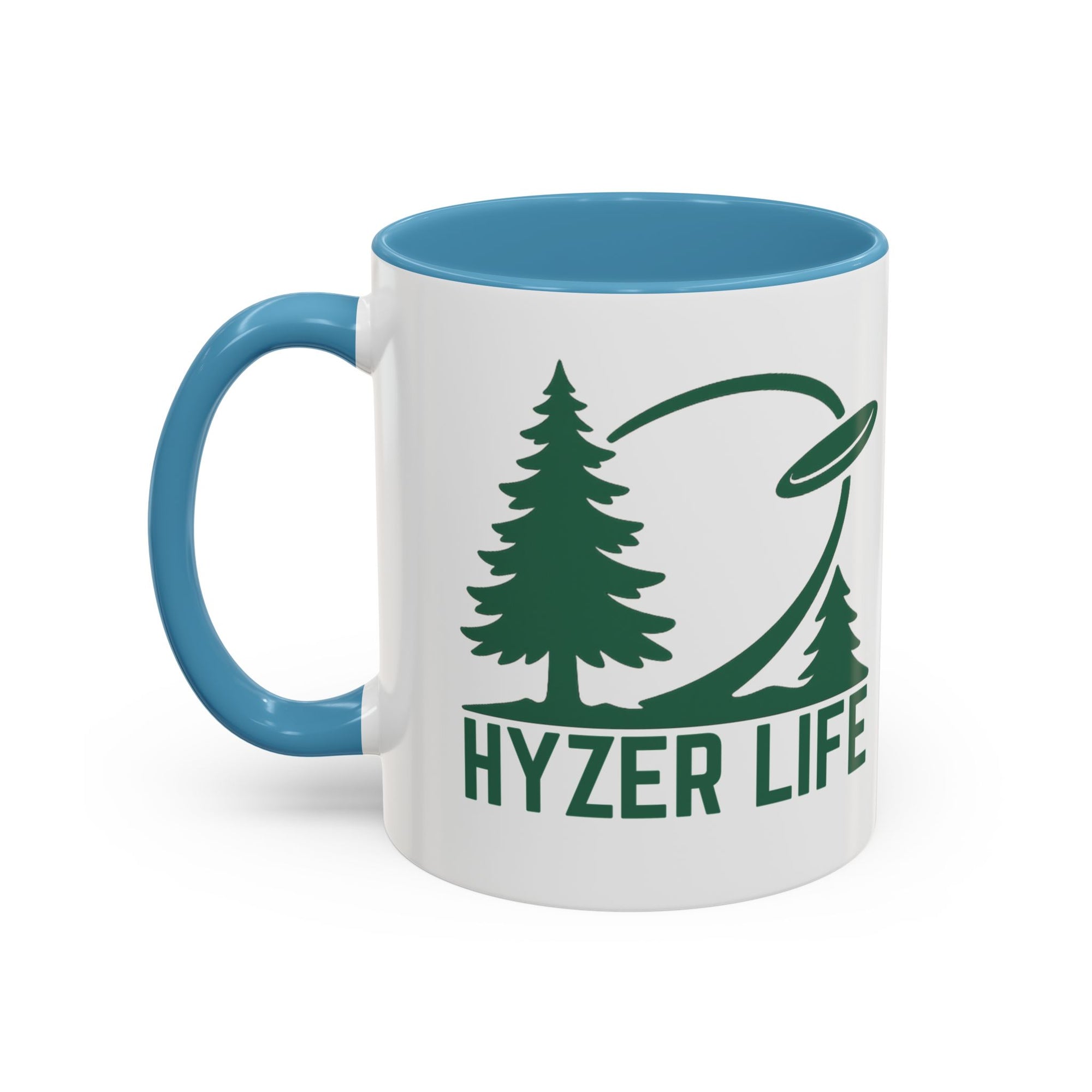 Ceramic coffee mug with light blue accents on the handle and interior, with green graphic of trees and a disc golf flying with the words 'HYZER LIFE' below the image, against a white background