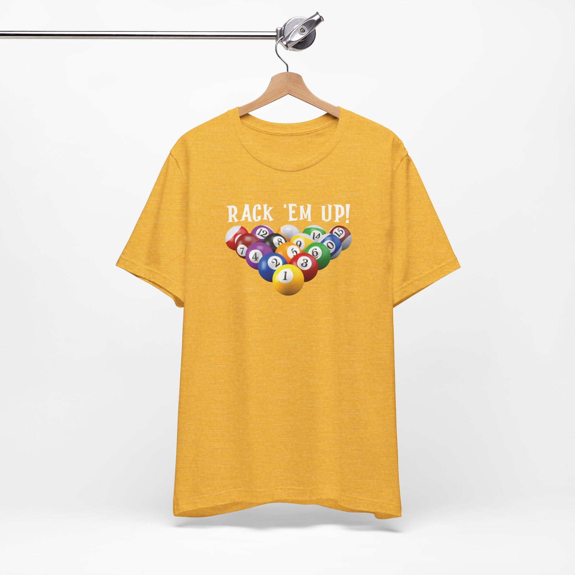 Yellow t-shirt with racked pool ball design and 'Rack 'Em Up!' text, on a hanger against a white background
