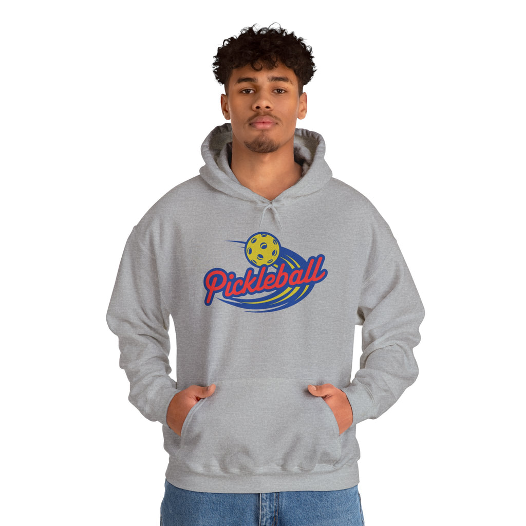 Man wearing a gray hoodie with a classic pickleball logo featuring the word pickleball and a yellow pickleball with motion lines, against a white background