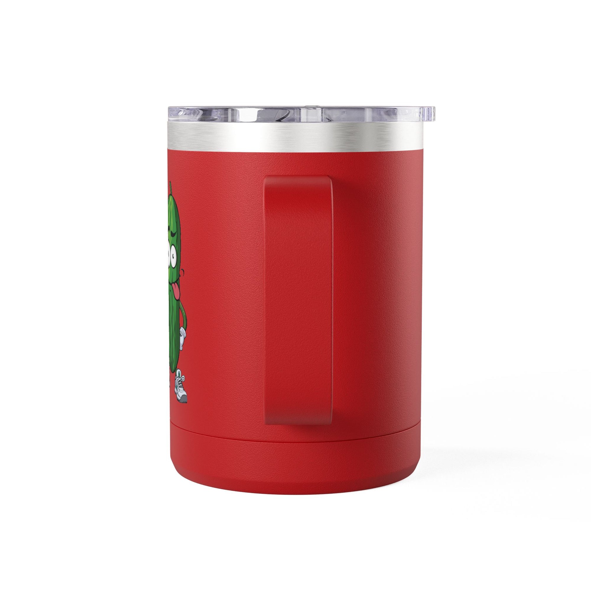 The handle view of a red travel coffee mug tumbler with handle and lid with a cartoon pickle with googly eyes and his tongue sticking out, holding a pickleball paddle with a yellow pickleball, against a white background