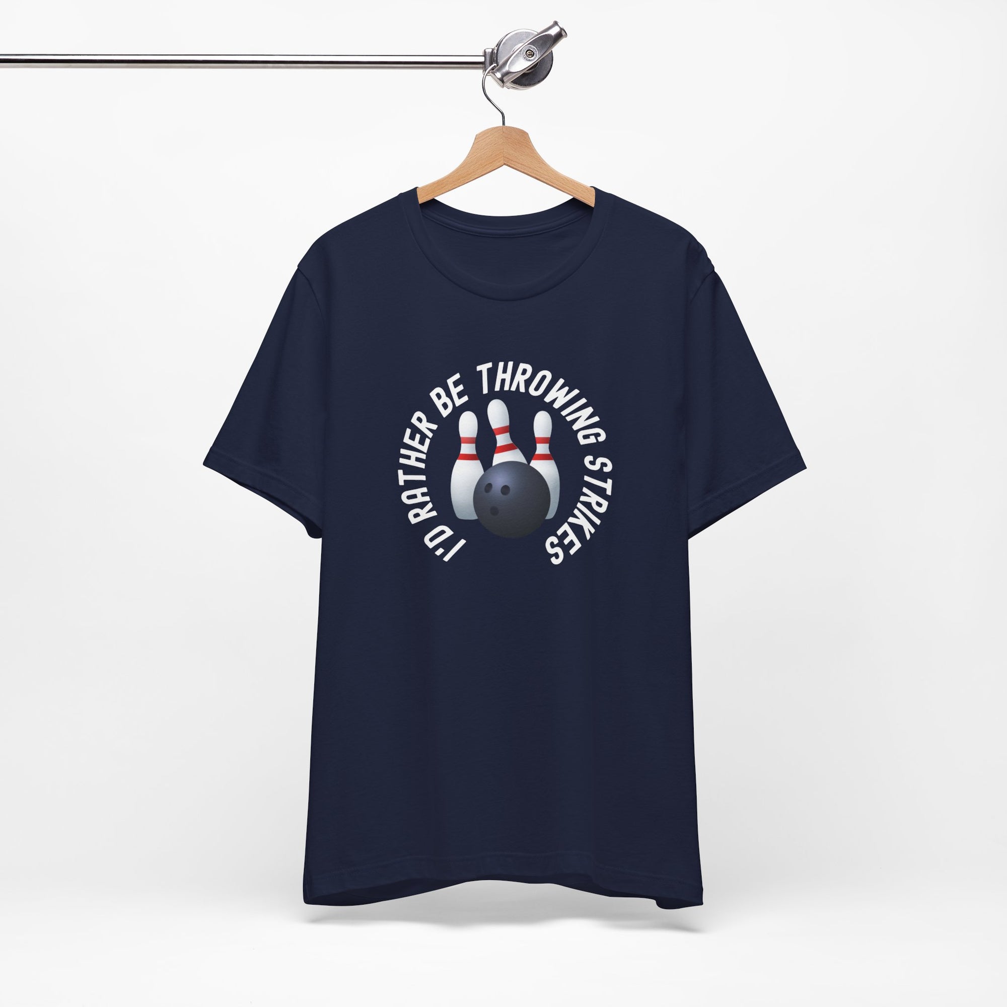 Dark blue t-shirt with bowling pins and a bowling ball and text saying "I'd Rather Be Throwing Strikes" on a hanger against a white background