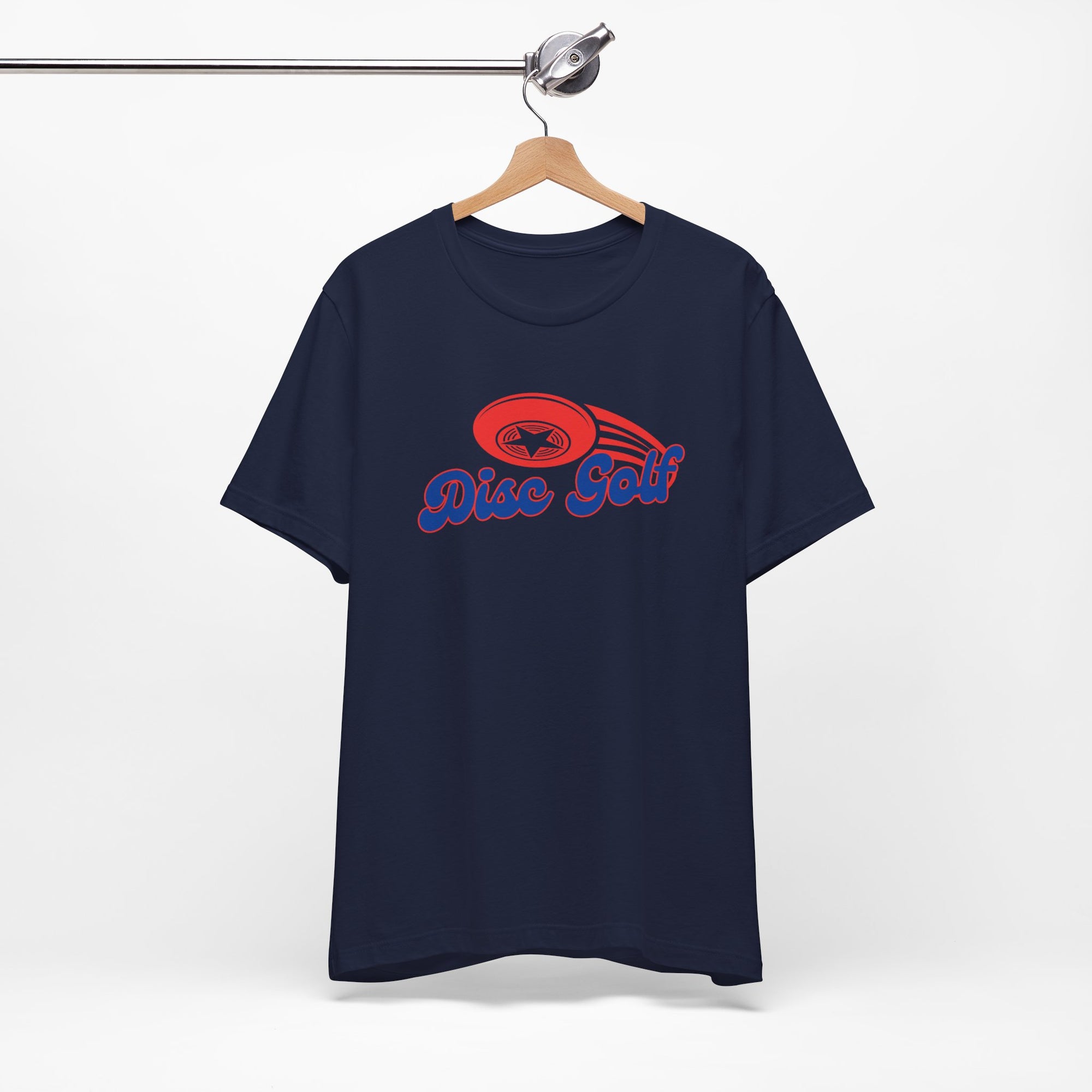 Navy blue t-shirt with 'Disc Golf' in a blue script text outlined in red and disc golf with motion trails, on a hanger against a white background