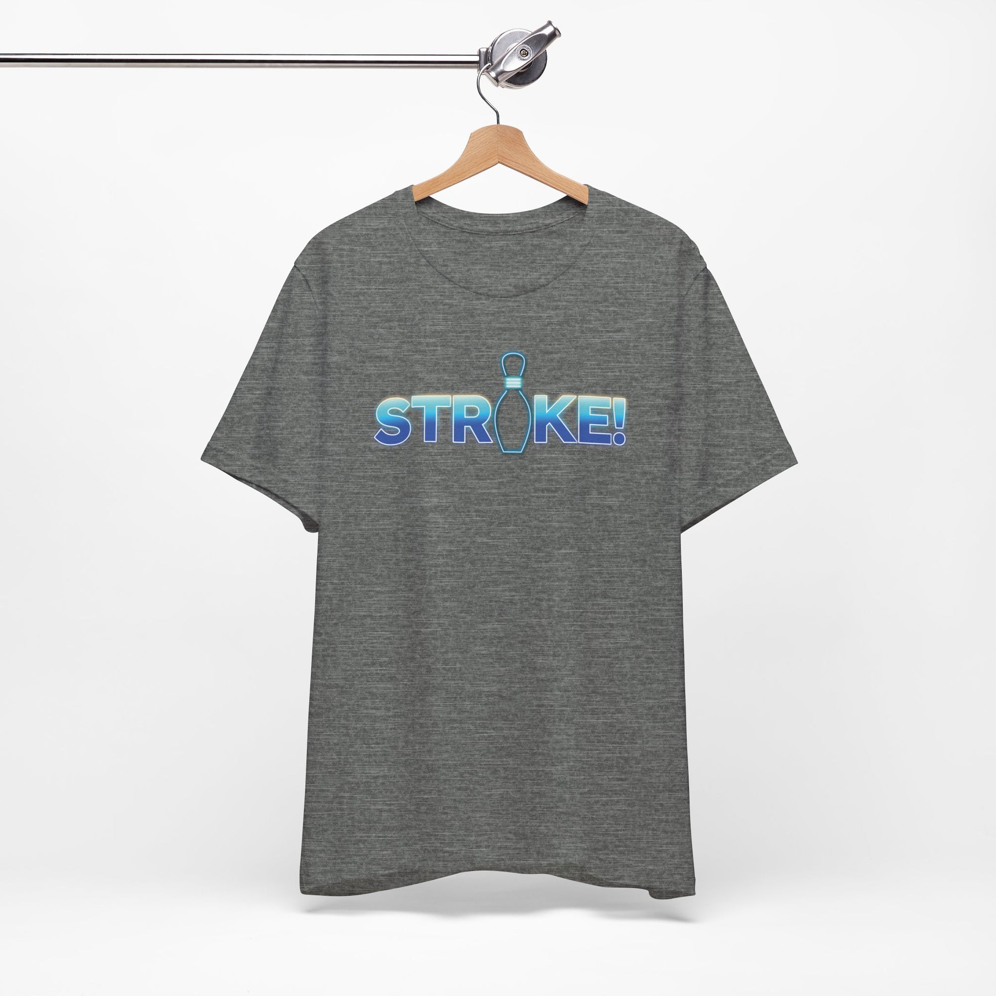Gray bowling t-shirt with 'STRIKE!' with the "I" replaced by a bowling pin, on a hanger against a white background