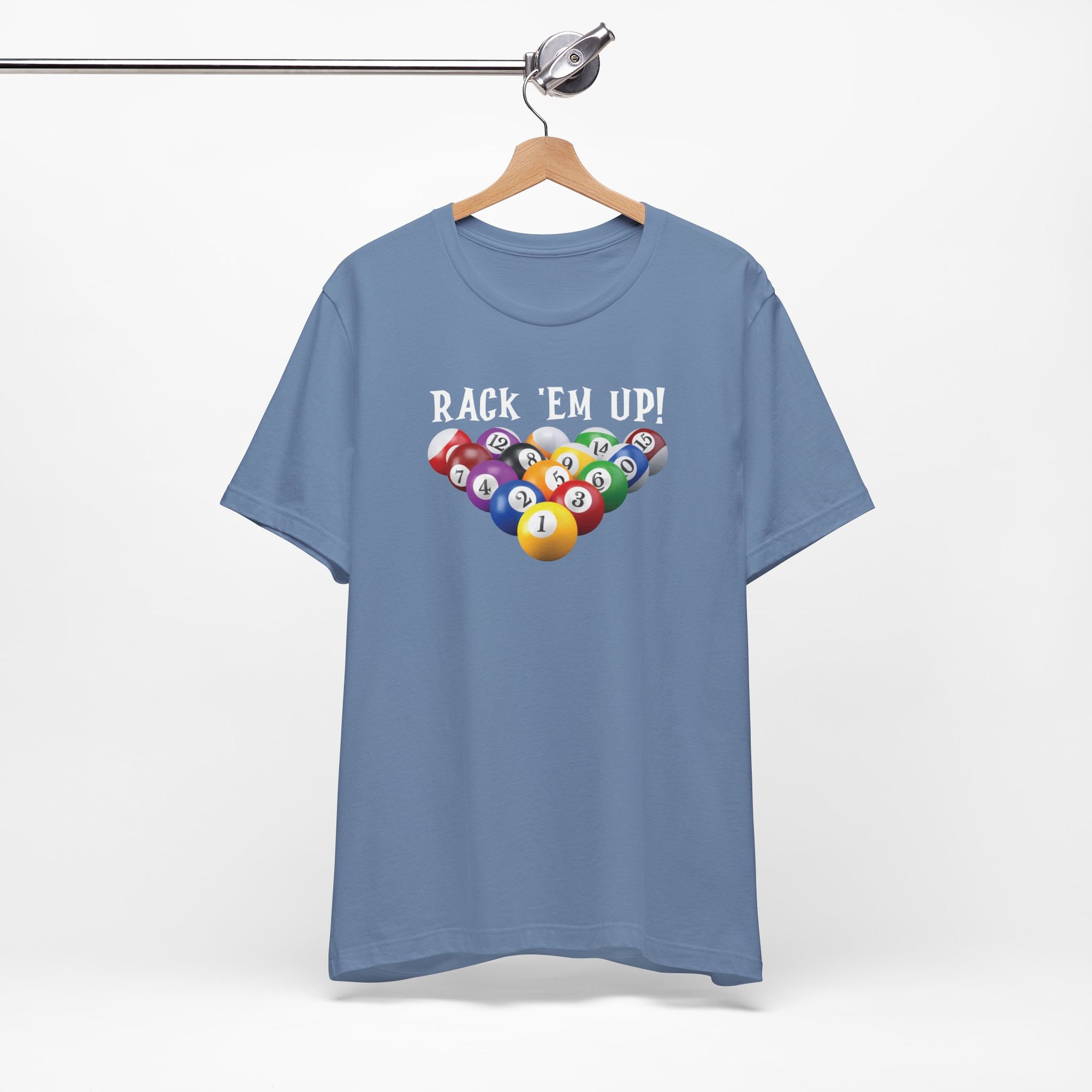 Steel blue t-shirt with racked pool ball design and 'Rack 'Em Up!' text, on a hanger against a white background
