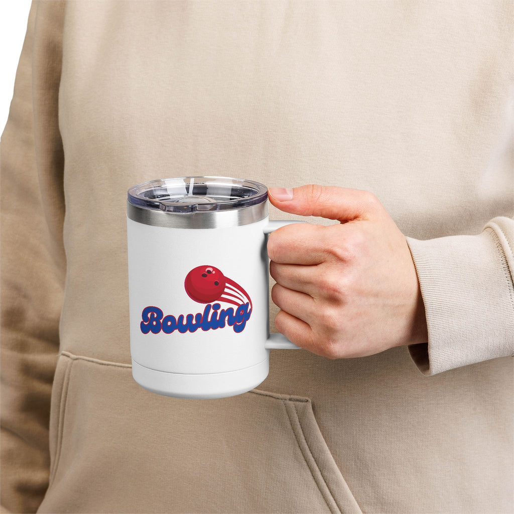 A person holding a white travel mug with lid and handle with red bowling ball and blue 'Bowling' text