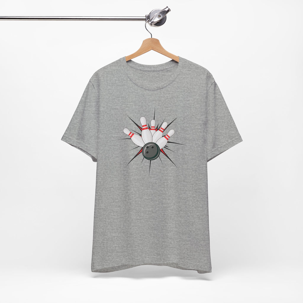 Gray t-shirt with a graphic design of a bowling ball smashing into pins on a hanger against a white background