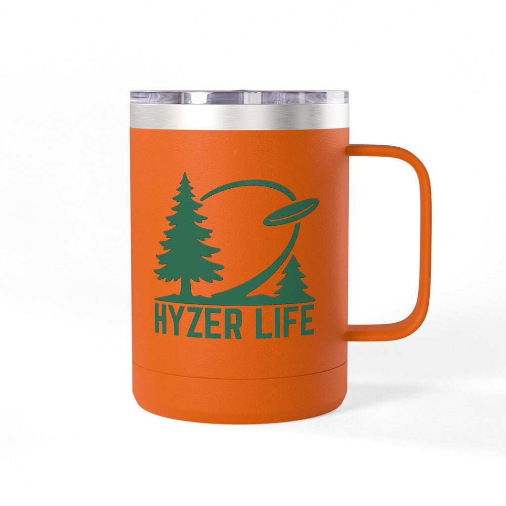 Orange stainless steel coffee tumbler with lid and handle with green graphic of trees and a disc golf flying with the words 'HYZER LIFE' below the image, on a white background 