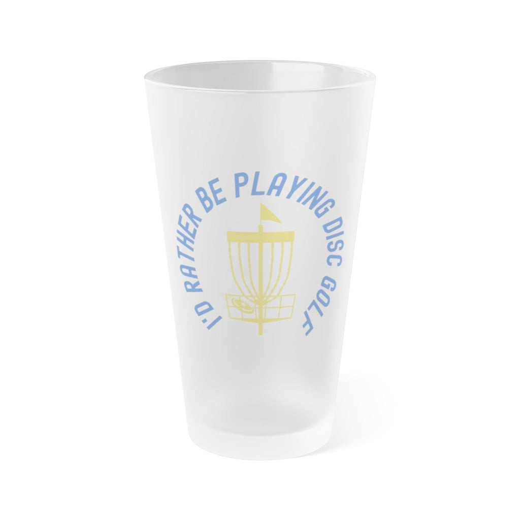 A frosted pint glass with disc golf chains and basket with the text "I'd Rather Be Playing Disc Golf" surrounding them, on a white background