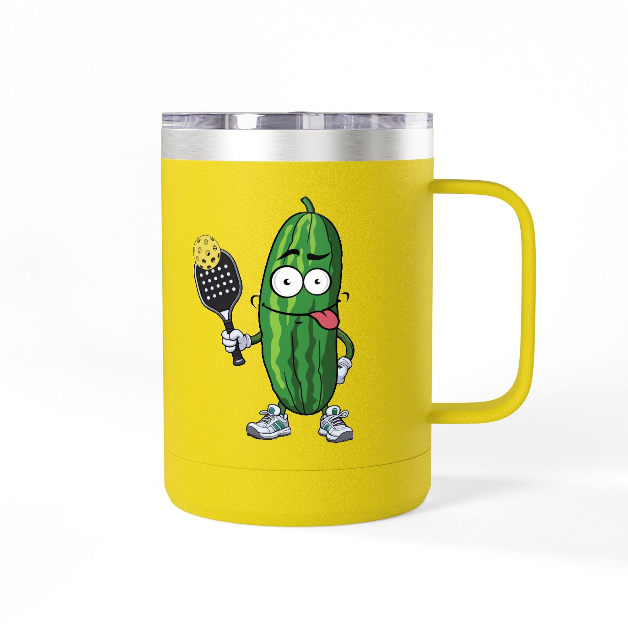 A yellow travel coffee mug tumbler with handle and lid with a cartoon pickle with googly eyes and his tongue sticking out, holding a pickleball paddle with a yellow pickleball, against a white background