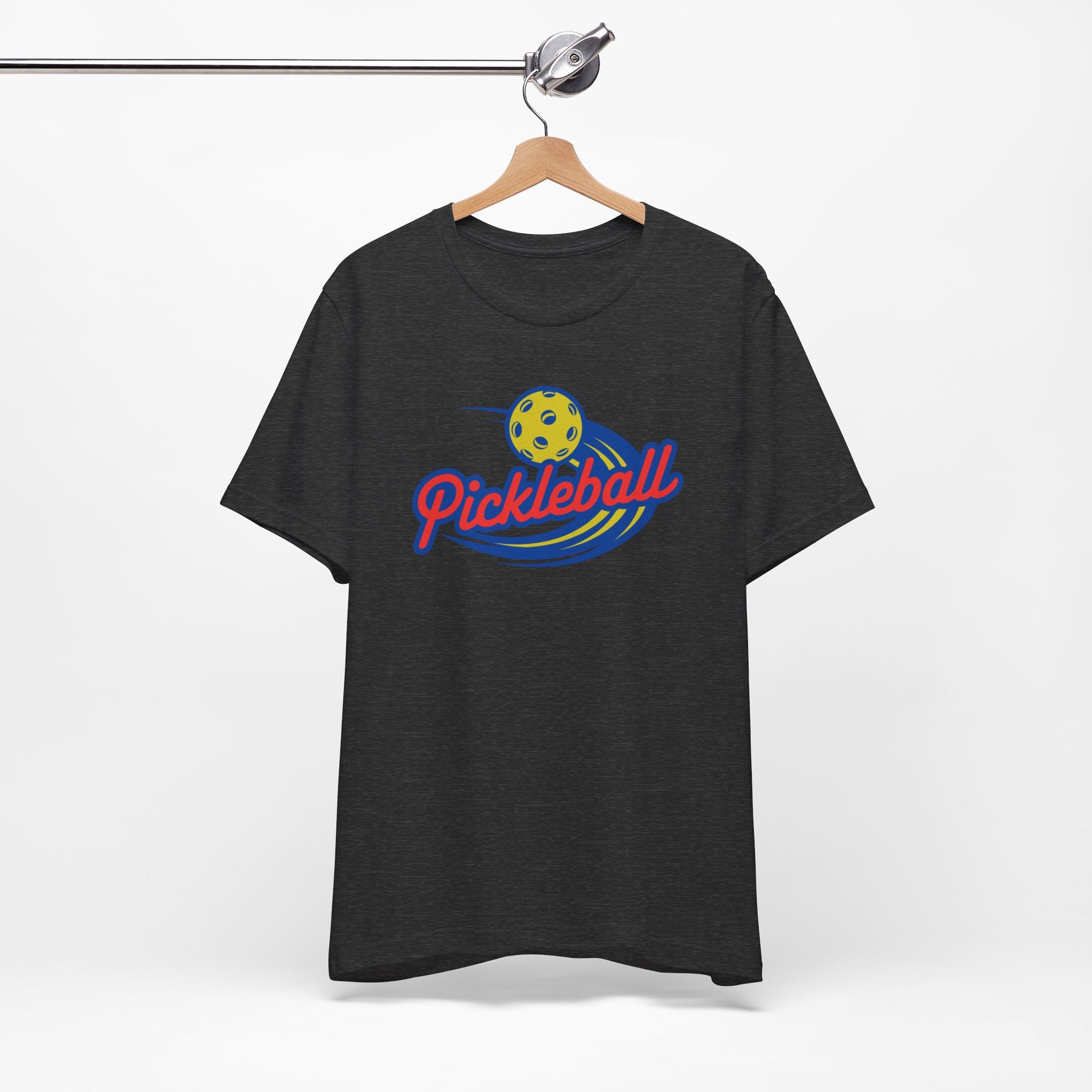 Gray t-shirt with a classic pickleball logo featuring the word pickleball and a yellow pickleball with motion lines, on a hanger against a white background