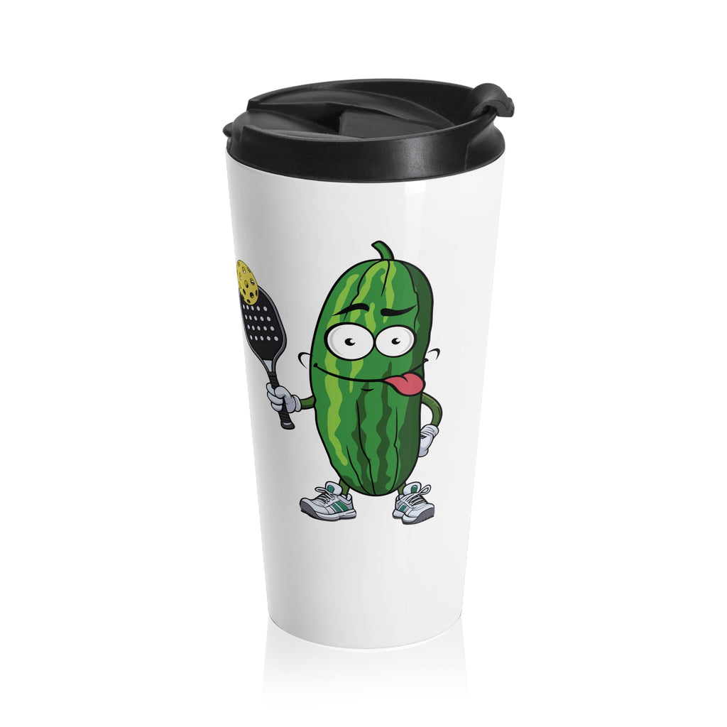 A white travel coffee mug with lid featuring a cartoon pickle with googly eyes and his tongue sticking out, holding a pickleball paddle with a yellow pickleball, against a white background