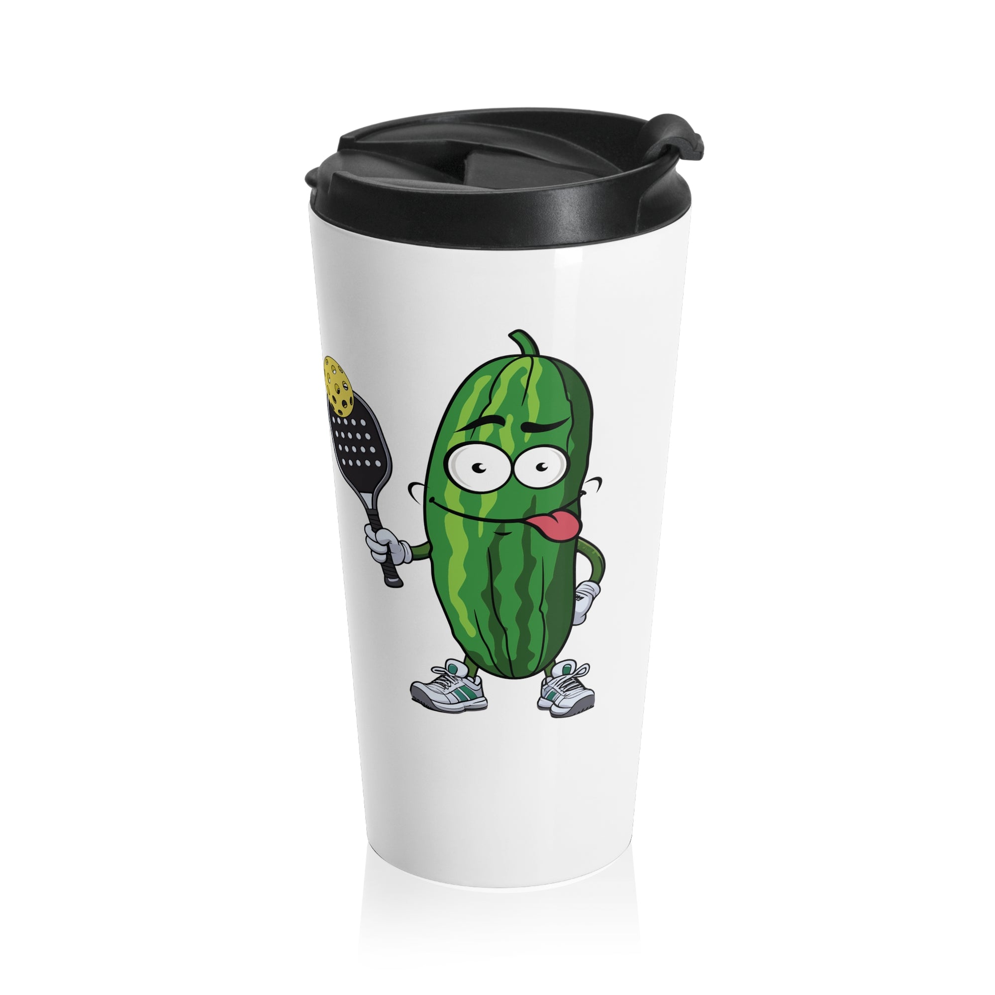 A white travel coffee mug with lid featuring a cartoon pickle with googly eyes and his tongue sticking out, holding a pickleball paddle with a yellow pickleball, against a white background