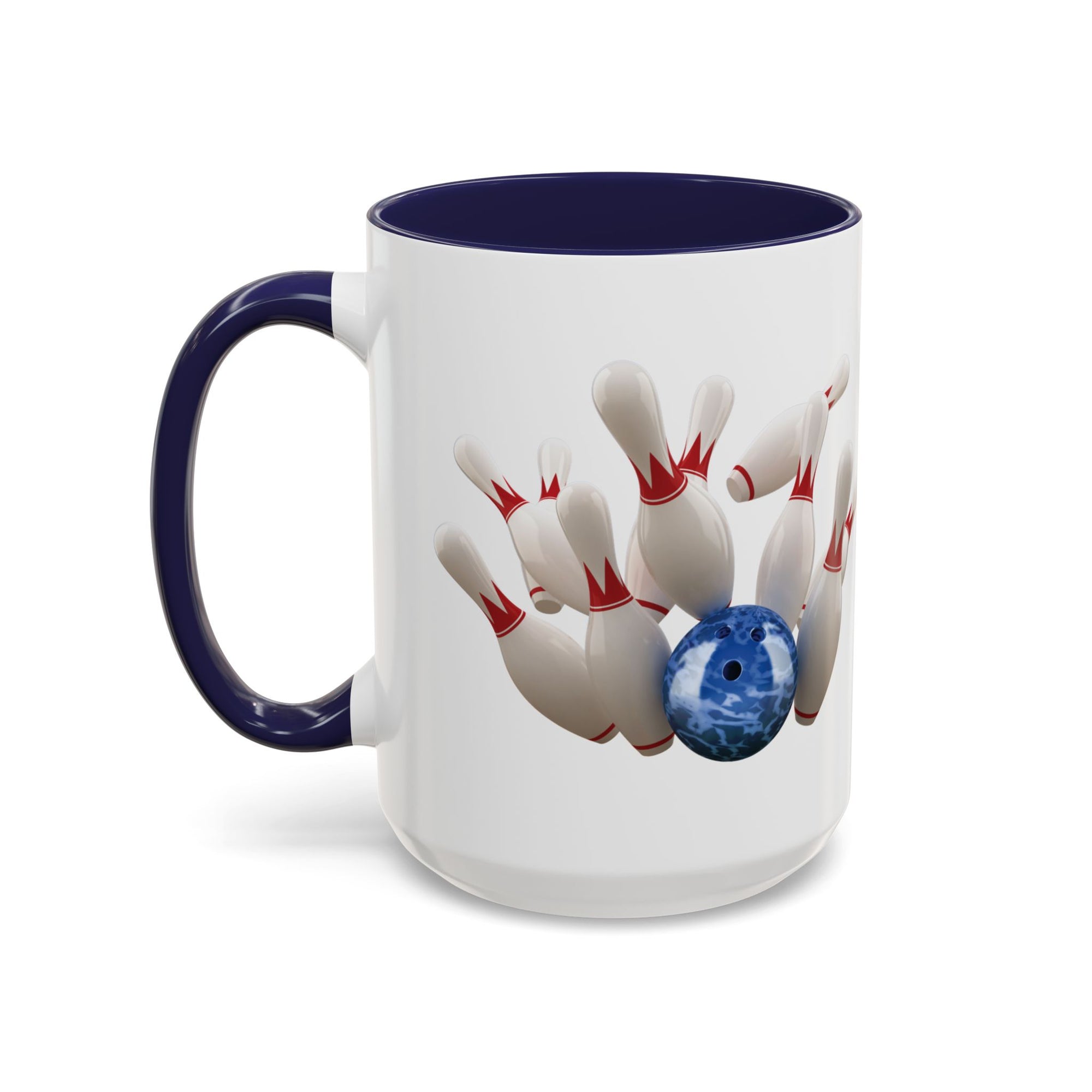 A white ceramic coffee mug with dark blue accents on the handle and interior, with a graphic of a blue bowling ball knocking over bowling pins, on a white background