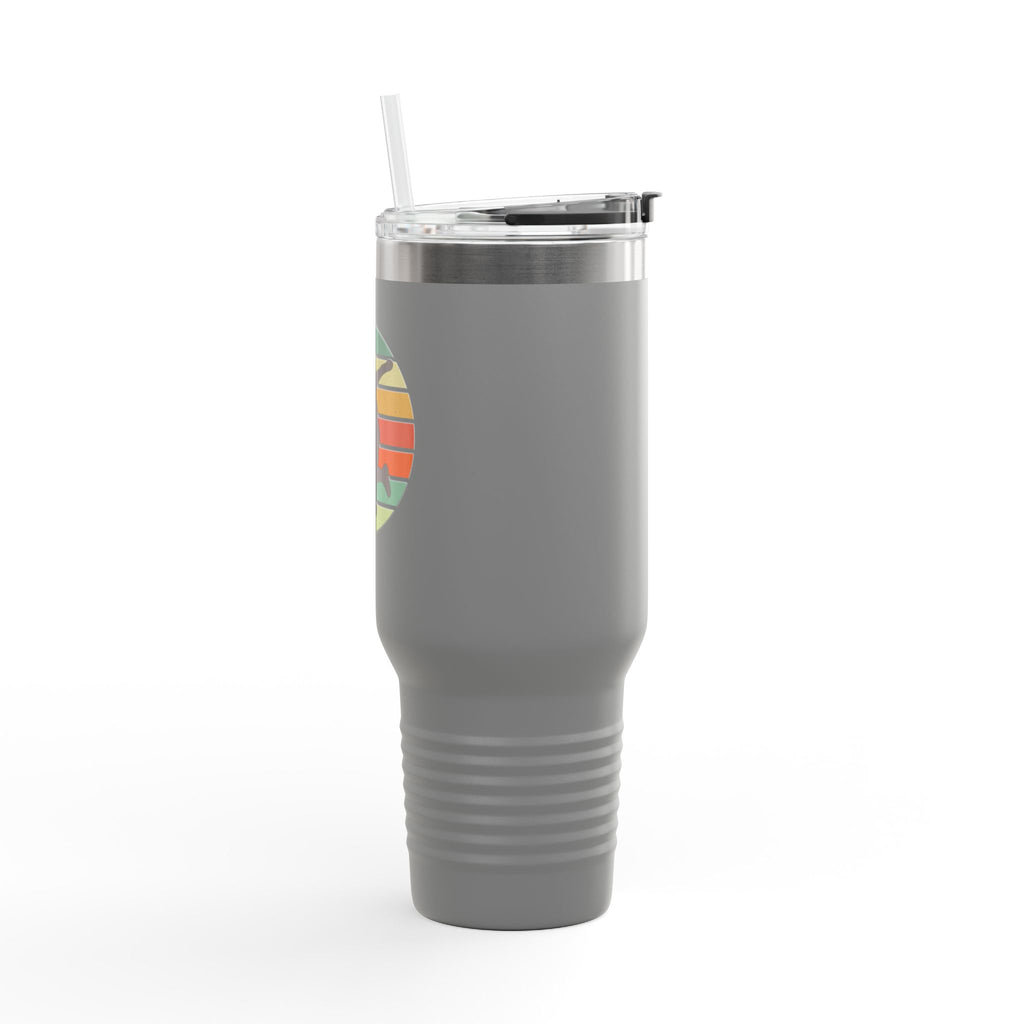 Side view of a grey 40oz stainless steel tumbler with handle, lid, and straw, with an image of a silhouette of a person playing disc golf over an colorful retro graphic, on a white background.