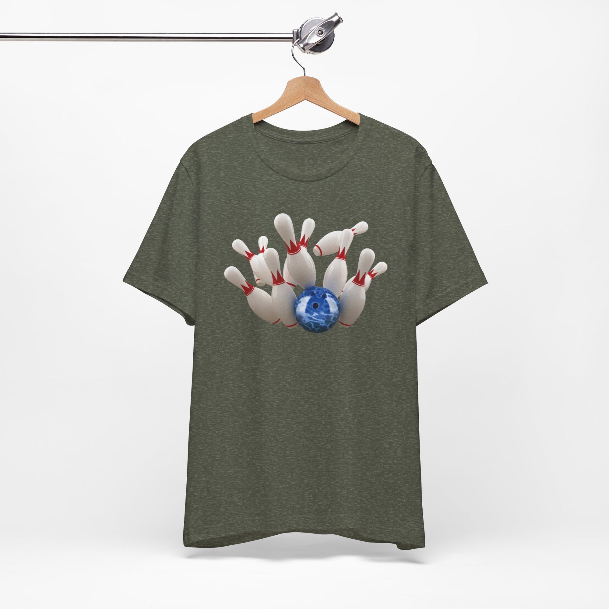 Military green t-shirt with a graphic of a blue bowling ball knocking over bowling pins, on a hanger against a white background